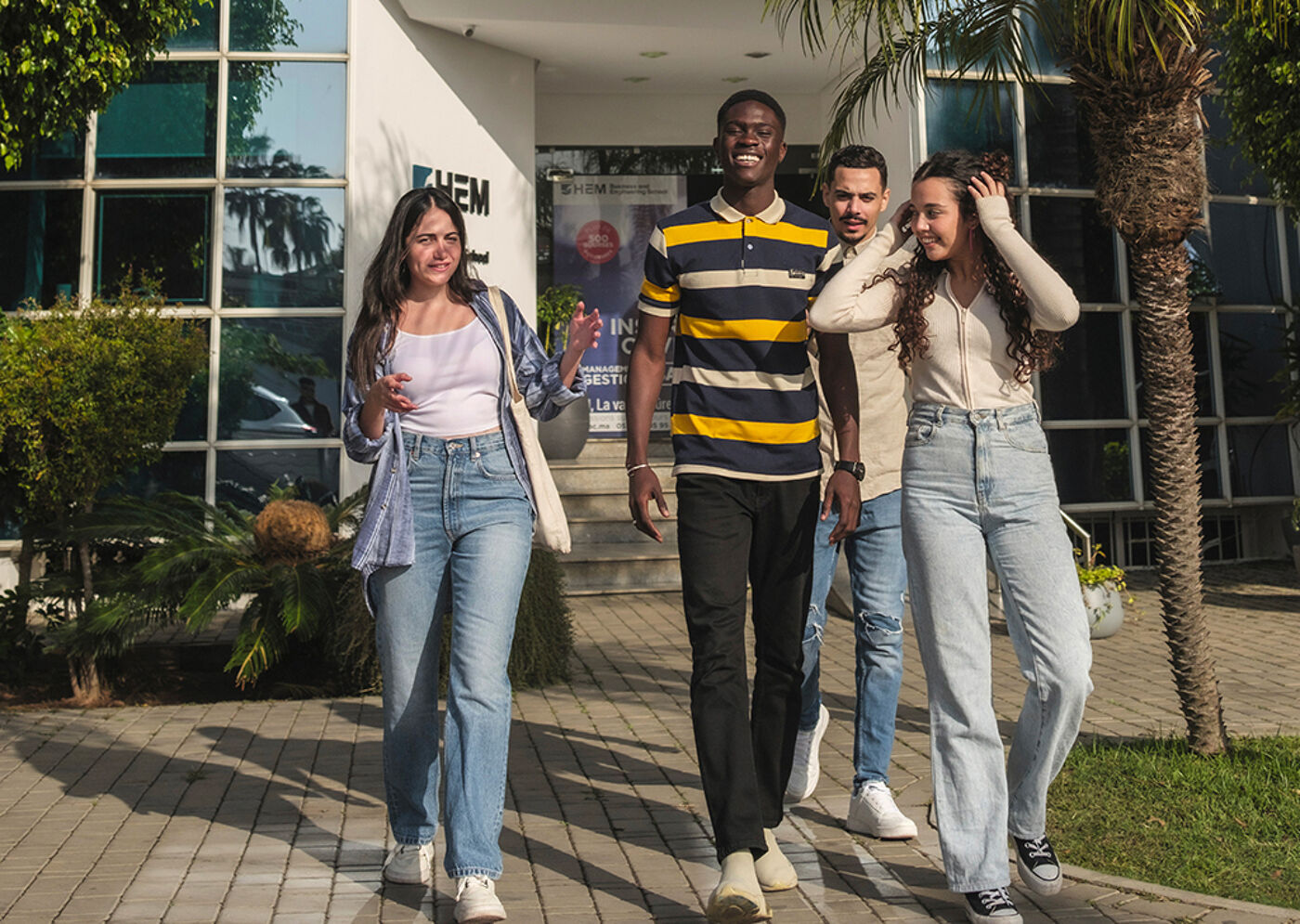 Group of Students Walking Outside a Campus Building