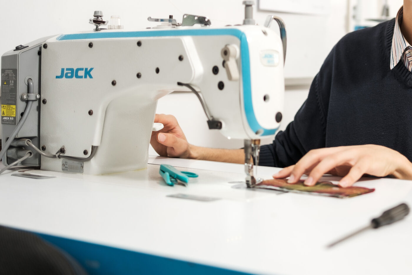 Tailor at Sewing Machine