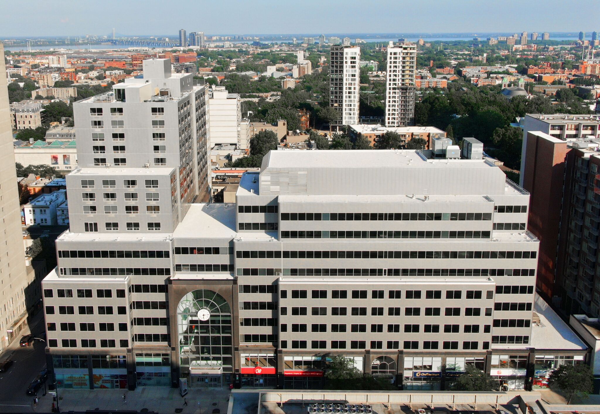 A bird's-eye view of a dense urban block, illustrating the blend of residential and commercial structures.