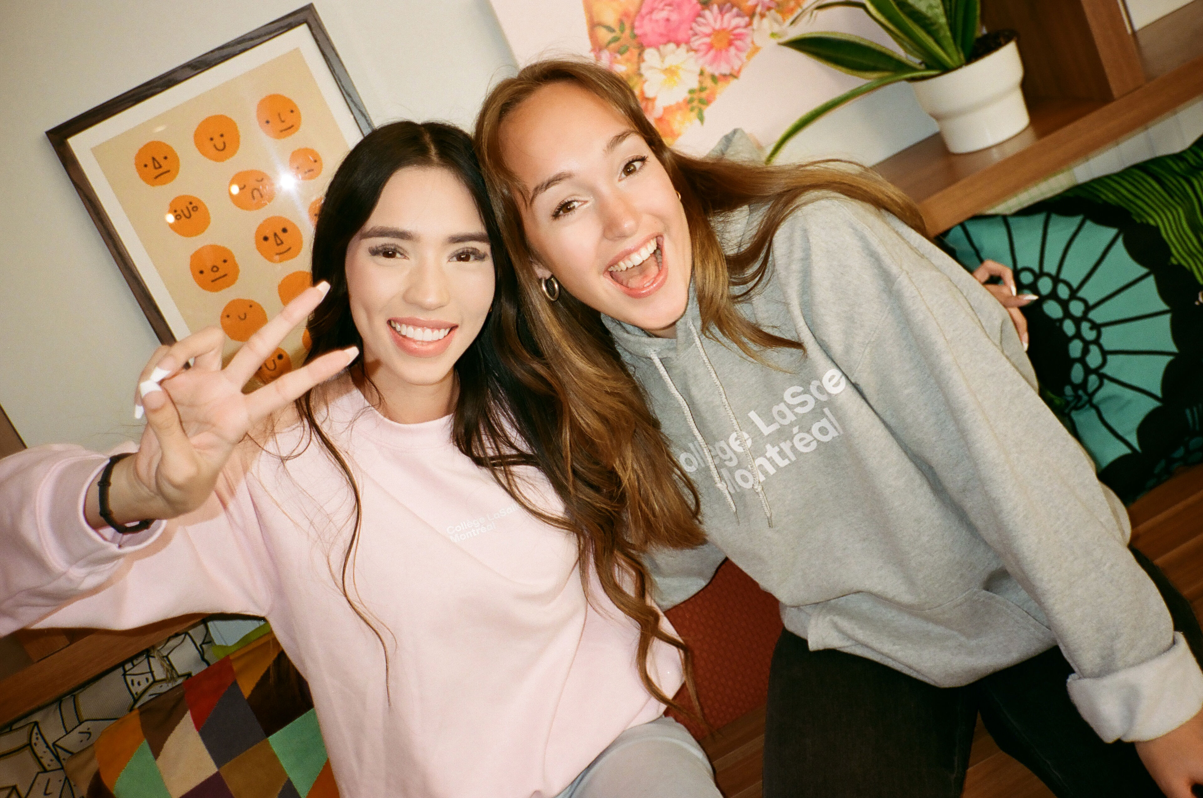 Two students sharing a joyful moment during a study break, radiating positivity and college spirit.