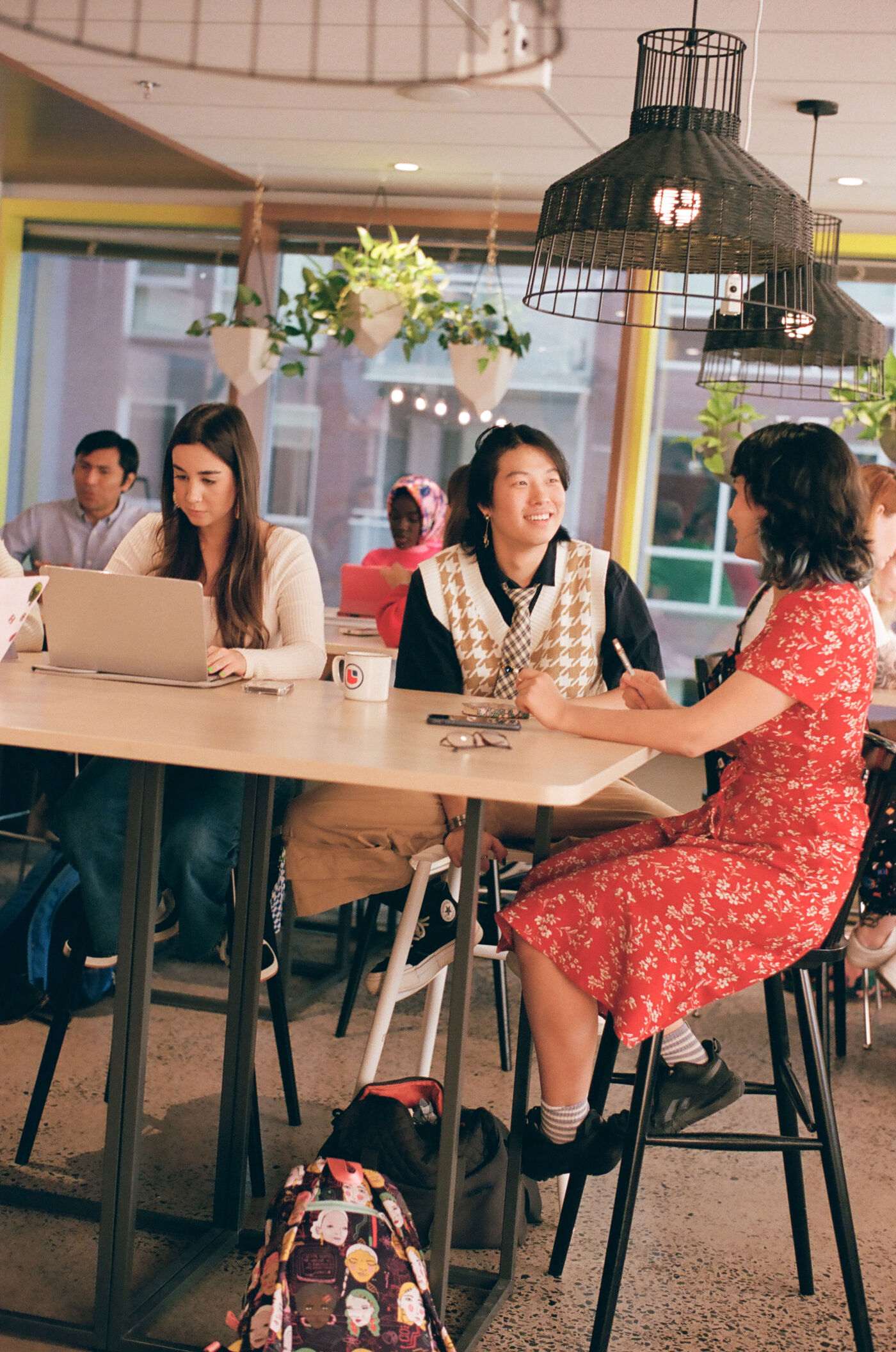 Students sharing ideas in a cozy college common area.