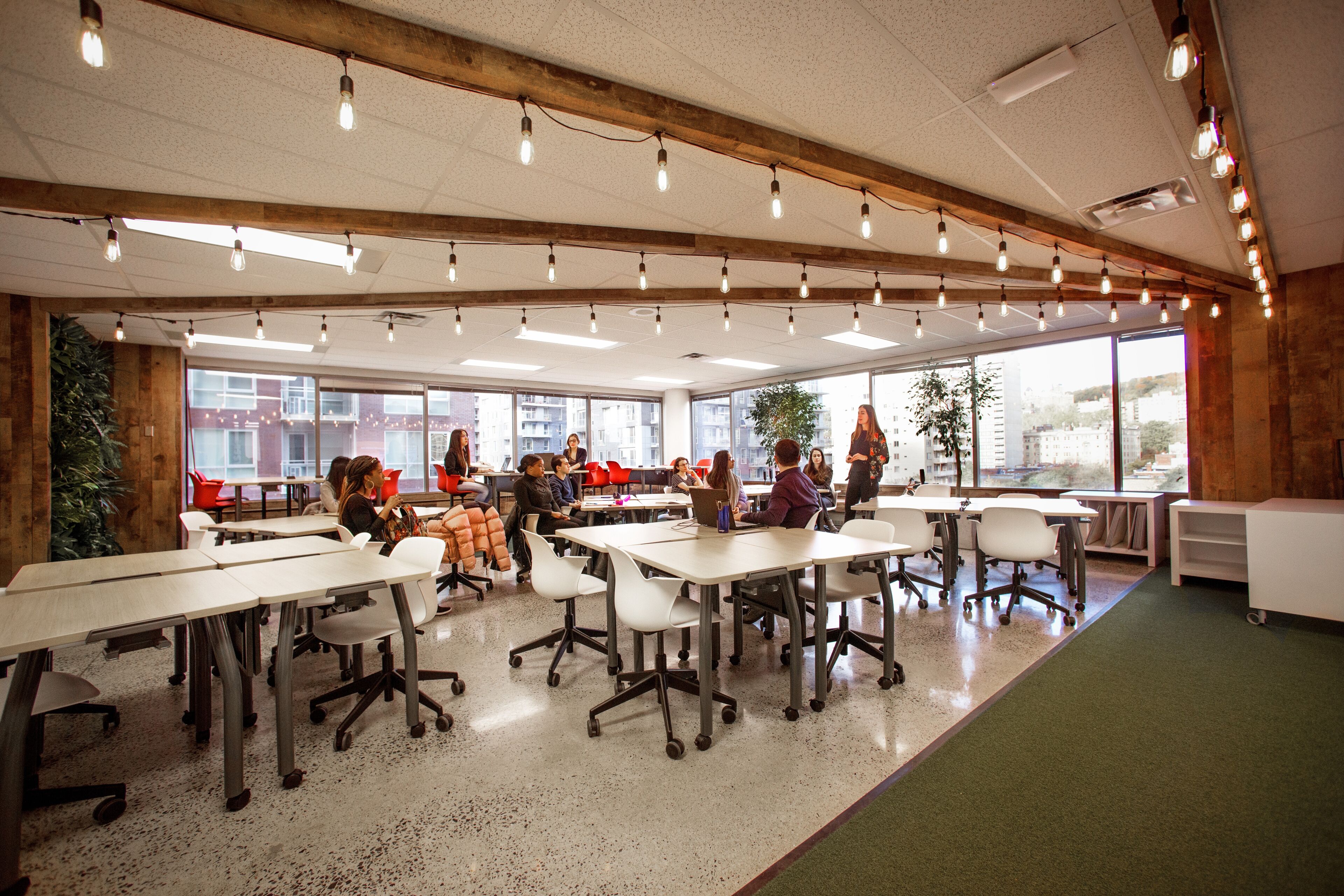 A vibrant classroom atmosphere with students participating in a dynamic workshop.