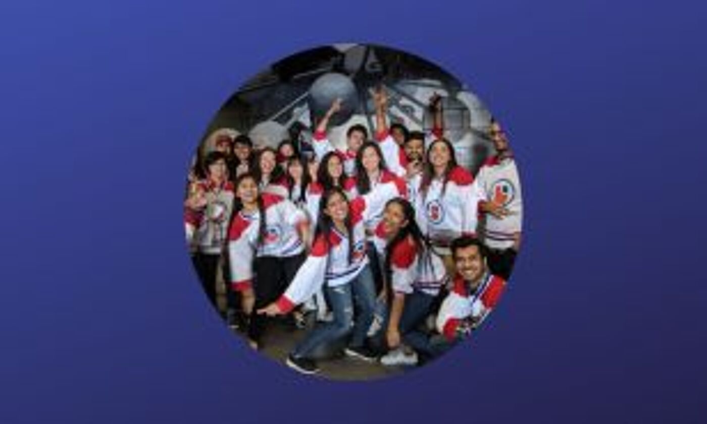 A cheerful group in sports jerseys, enjoying a moment of camaraderie in a group photo.