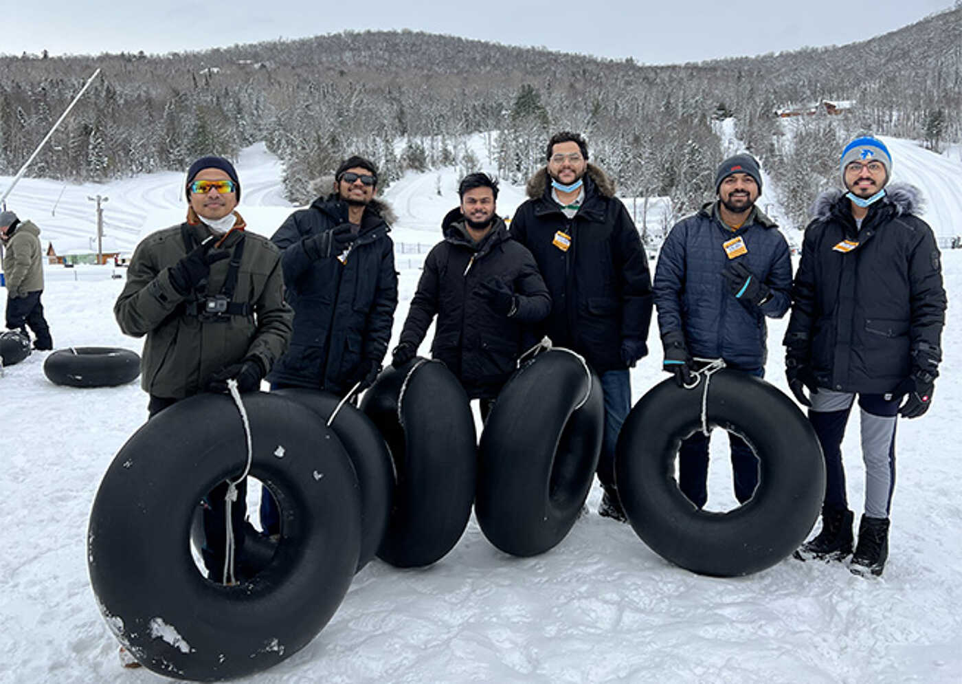 Group of Friends Ready for Snow Tubing