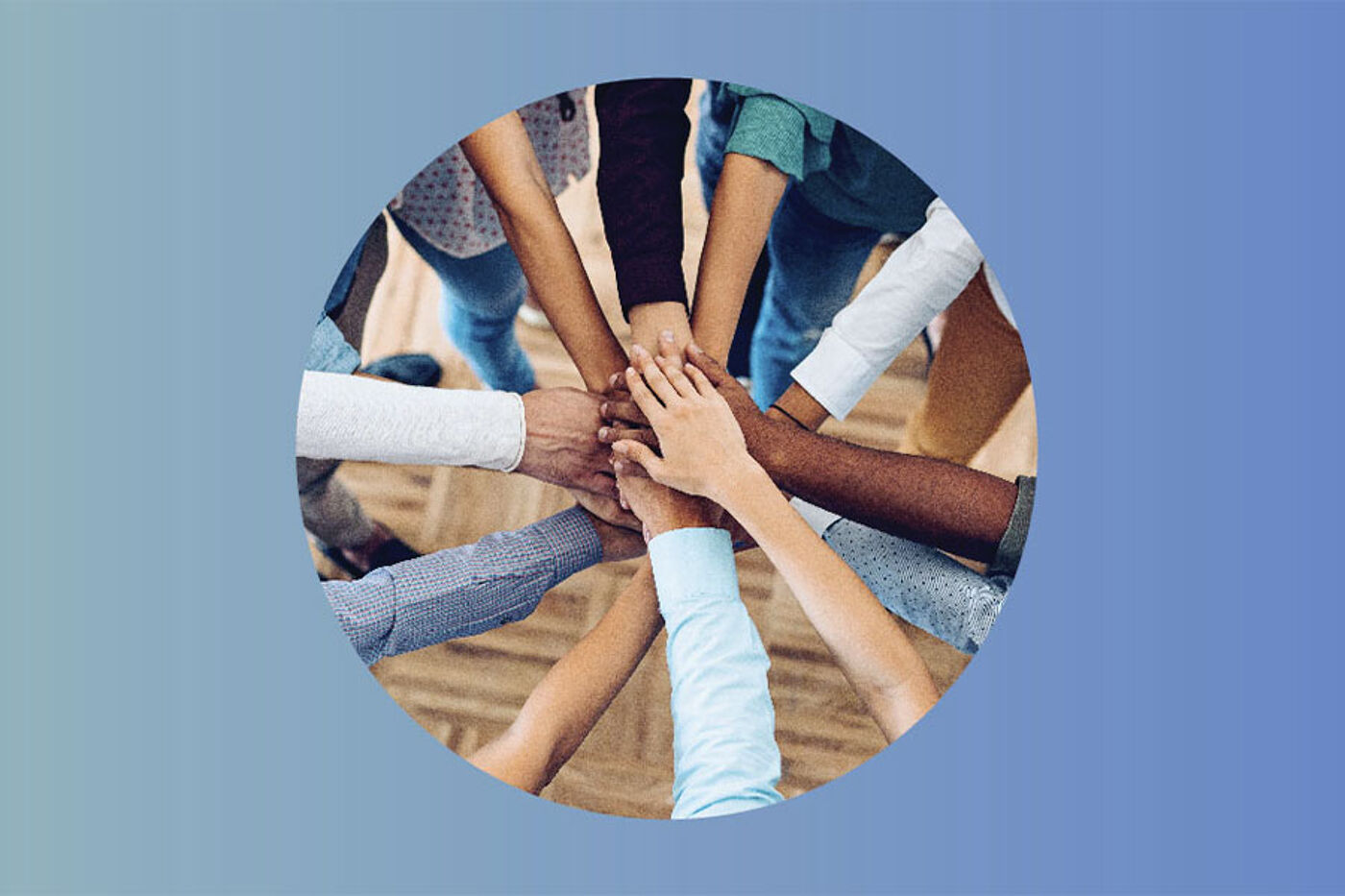 Overlapping hands in a circle, symbolizing teamwork and cooperation.