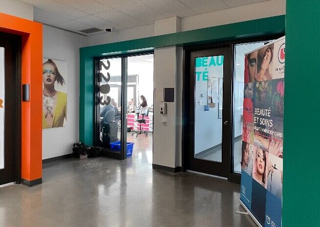 The vibrant beauty school corridor invites students into the world of fashion and aesthetics.