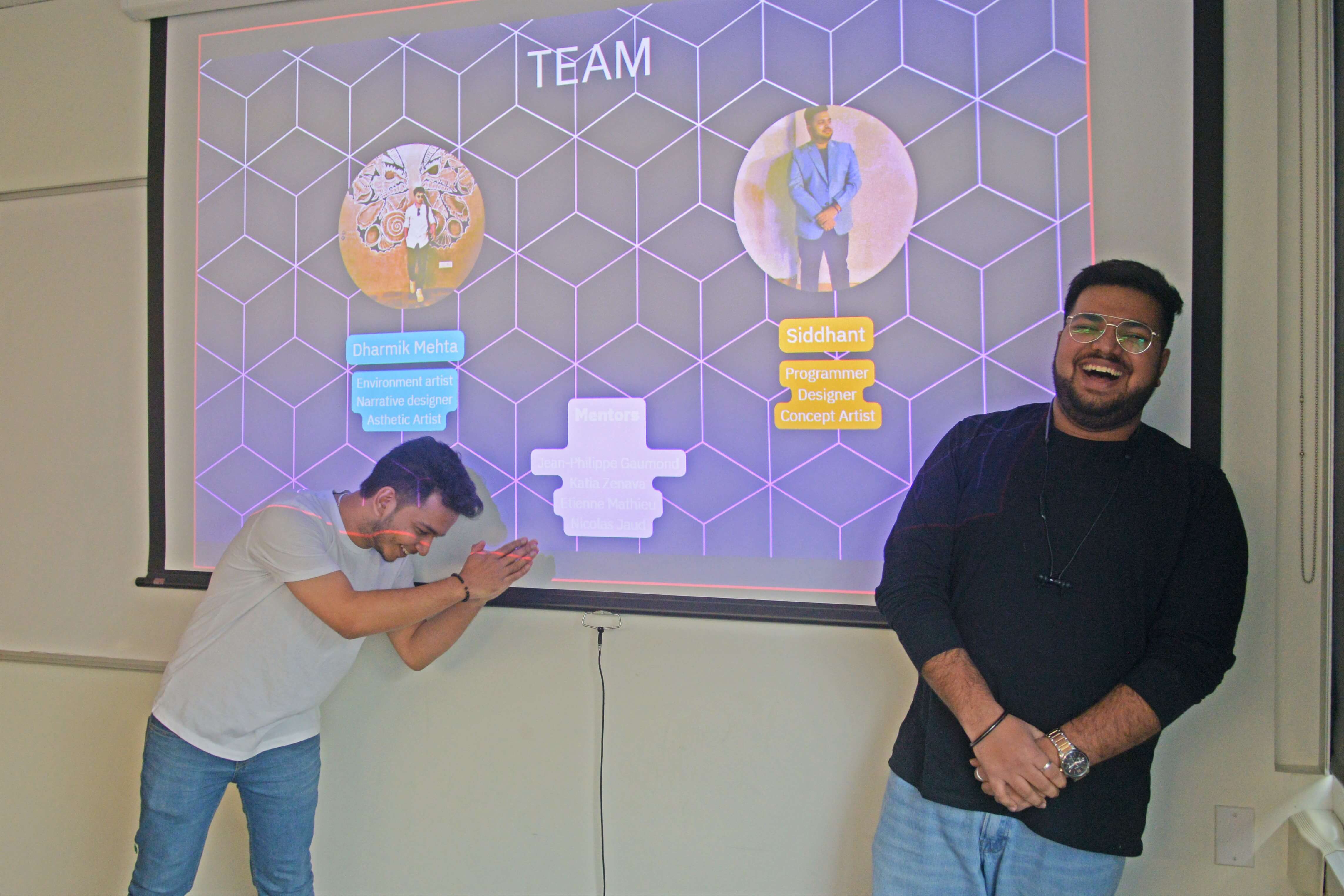 Two individuals presenting a team slide with personal profiles in a cheerful and interactive environment.