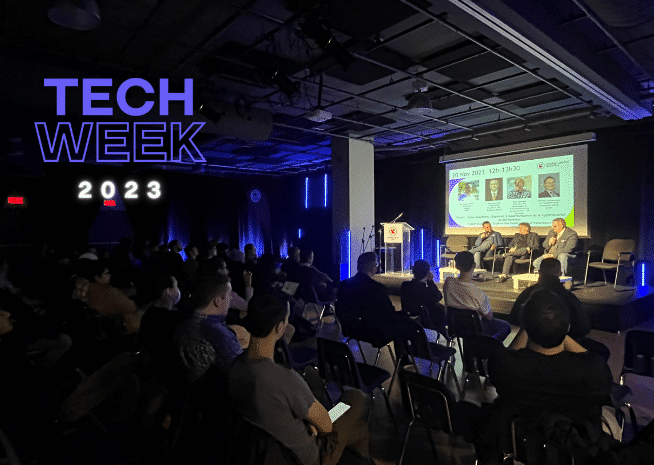 Audience attending a panel discussion at Tech Week 2023, with a focus on technology and innovation.