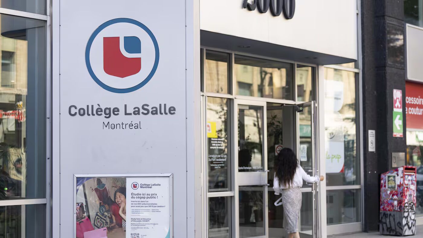 This is a building for Collège LaSalle in Montreal, with a person entering through the main doors. The college's logo is visible on the exterior.