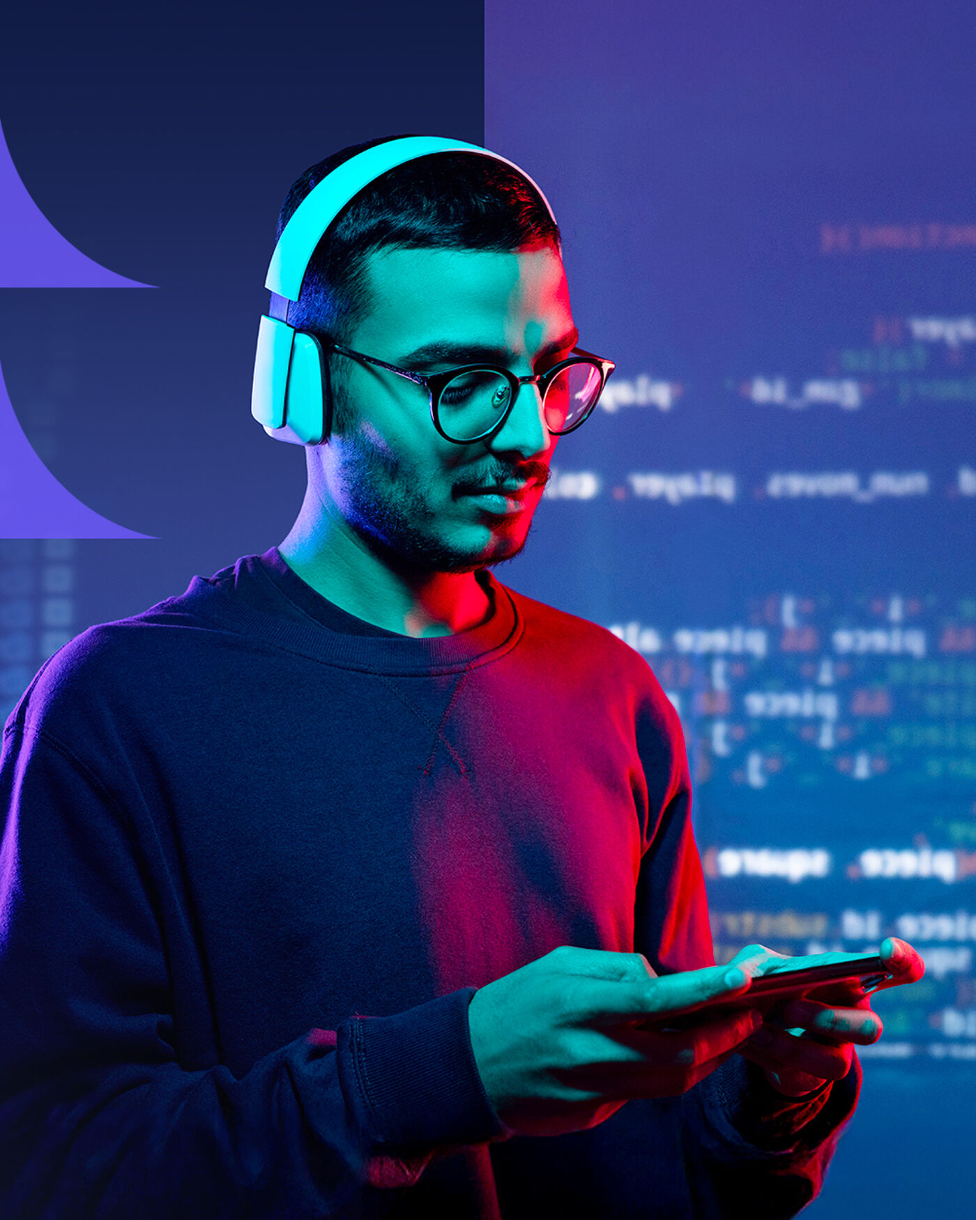 A man wearing headphones and glasses is looking at his phone. The background features blurred code, suggesting he might be a programmer or involved in technology. The lighting is colorful, with a mix of blue and red hues.
