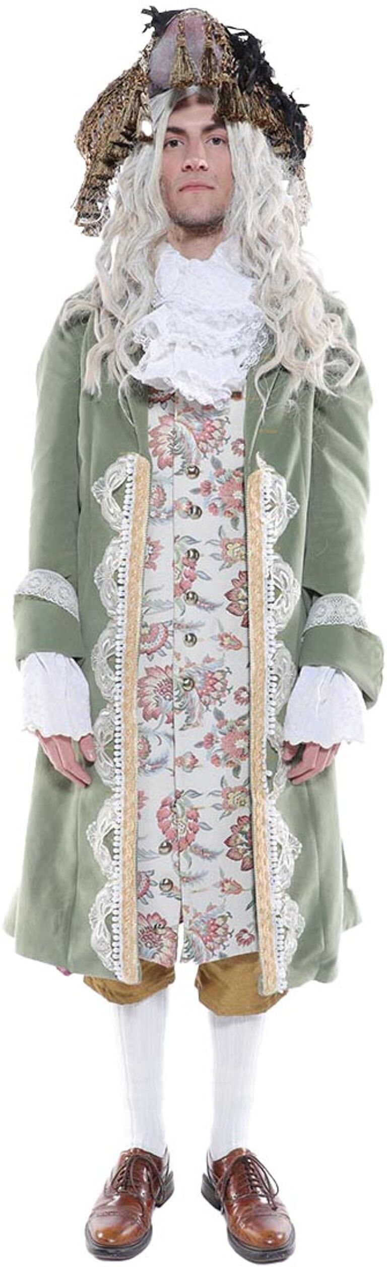 A man in a sage green coat with gold trim and lace accents, a floral waistcoat, white knee-high socks, brown shoes, and a large, ornate hat stands against a white background.