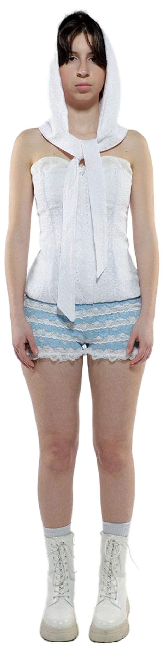 A young woman with dark hair, wearing a white hooded top, a white corset, light blue shorts with lace trim, white socks, and white boots, stands facing the camera.