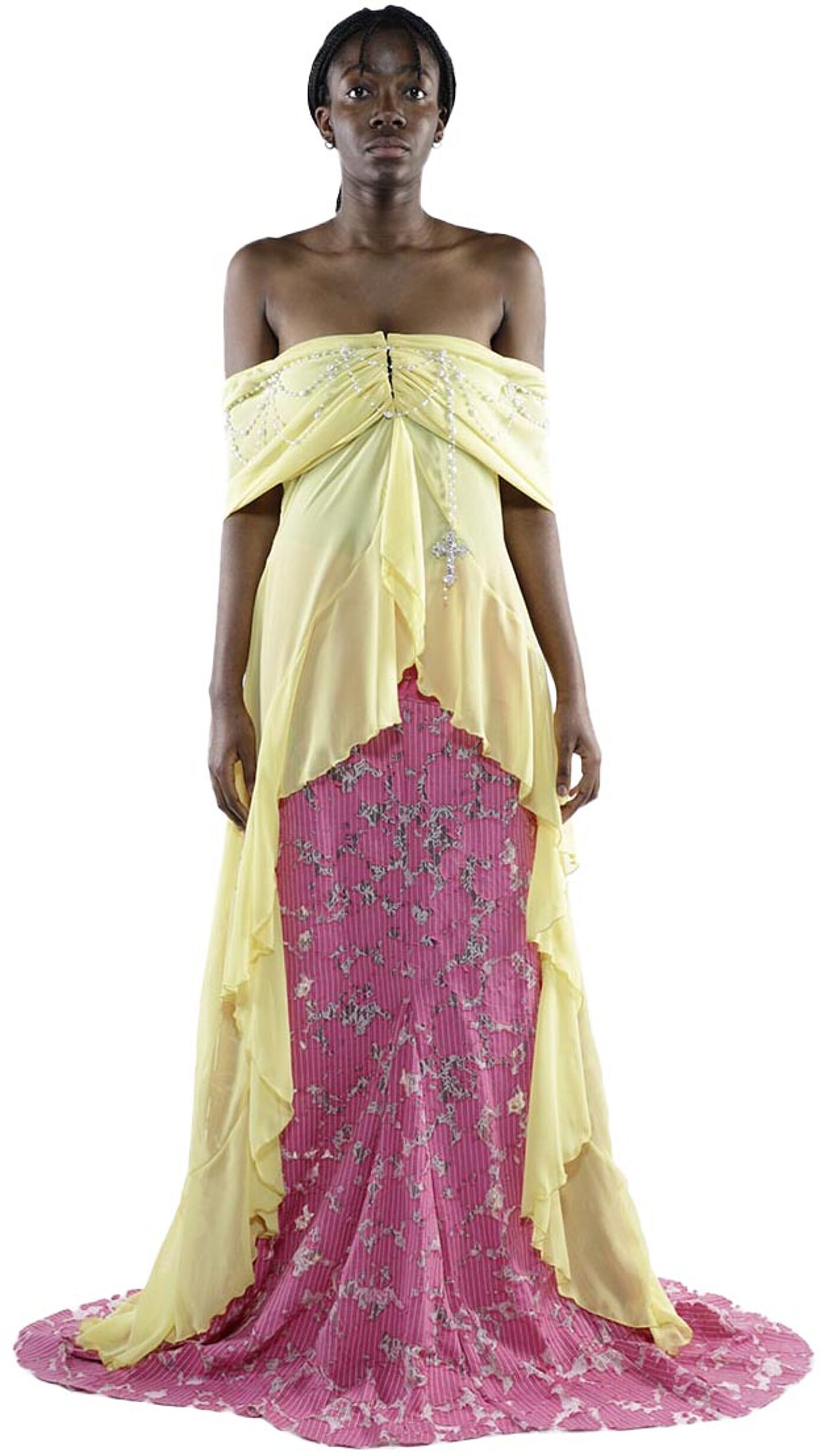 A dark-skinned woman with dark hair pulled back models a pale yellow off-the-shoulder overlay over a rose-pink, floral-patterned, pleated maxi skirt.