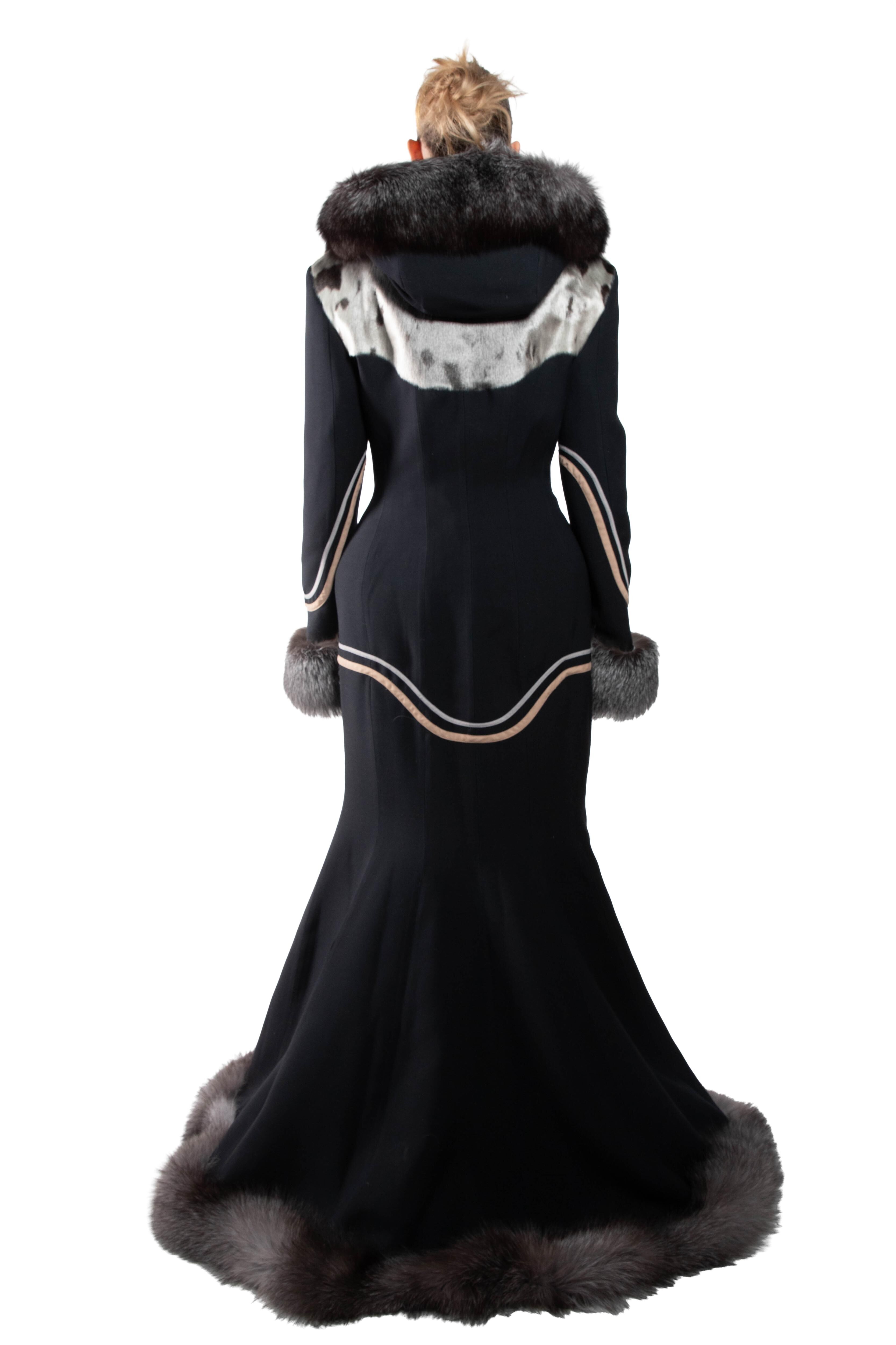 This is an image of a woman viewed from the back, wearing an elegant, floor-length gown with fur detailing.