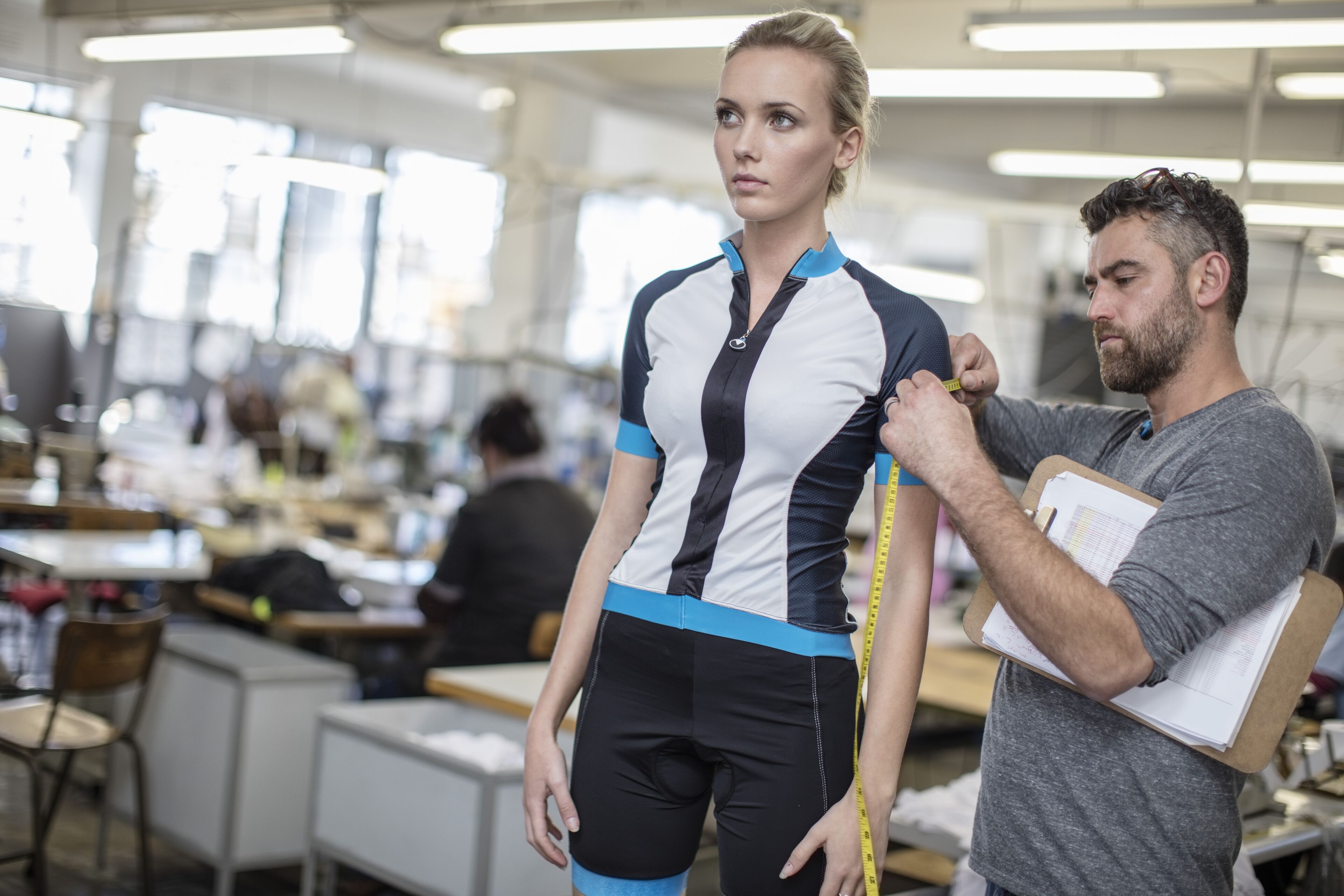 Tailor Measuring Athlete's Apparel