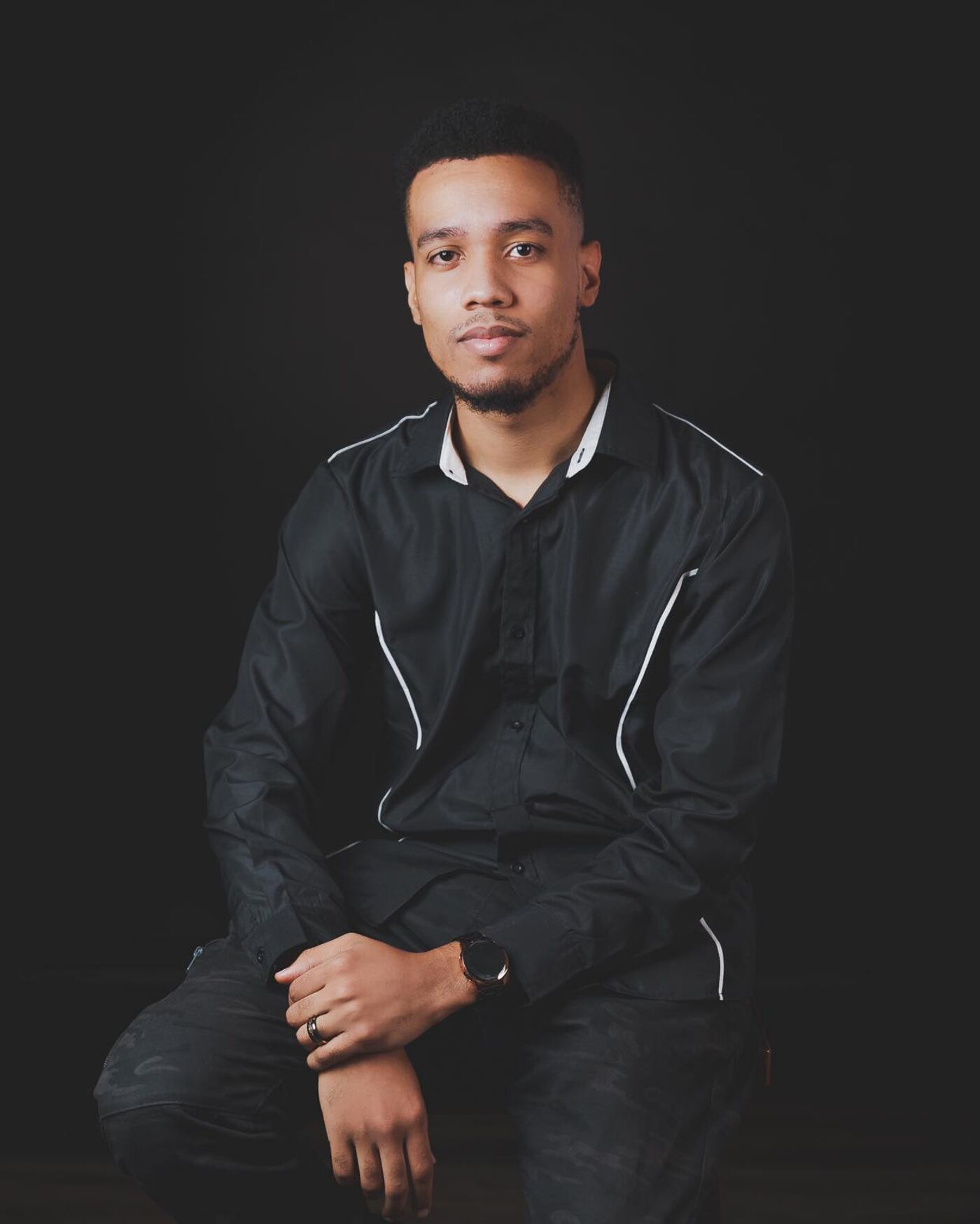 Confident Man in Black Shirt