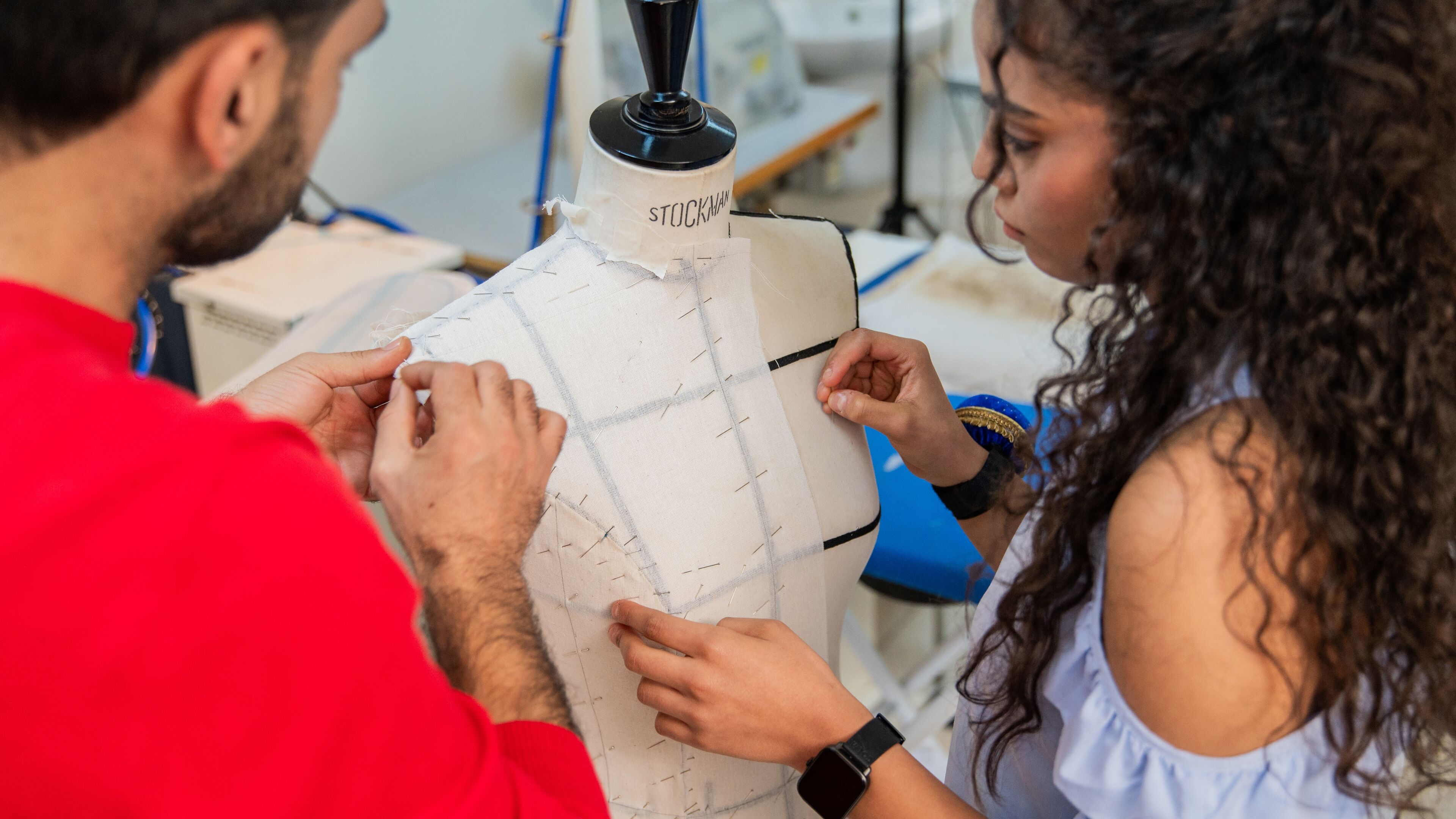 Tailors Adjusting a Mannequin