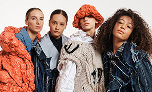Models showcasing an avant-garde fashion collection with textured garments and bold accessories.