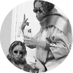 Two Women in Sunglasses Posing with Peace Signs