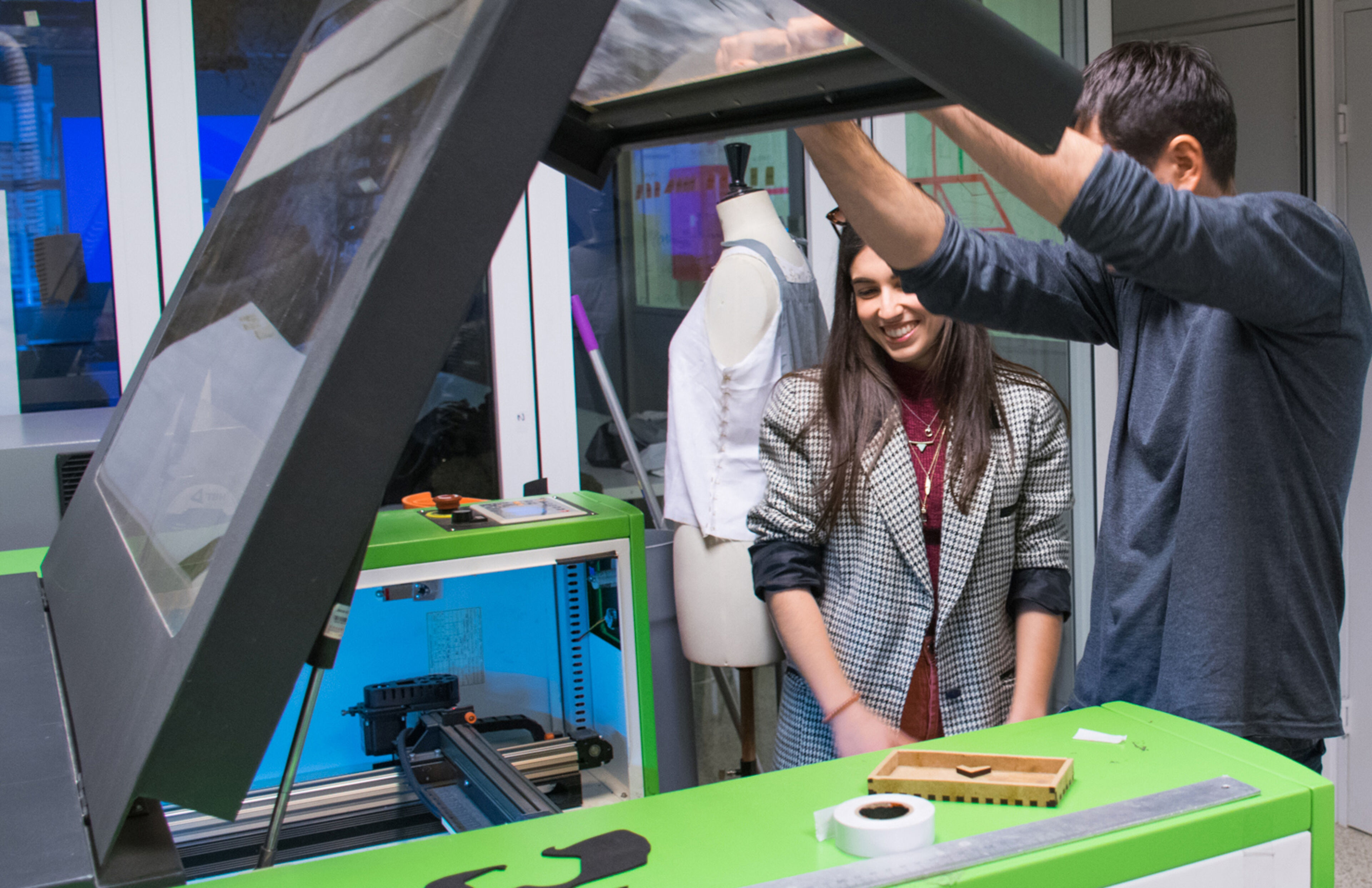 Students Operating a Laser Cutting Machine