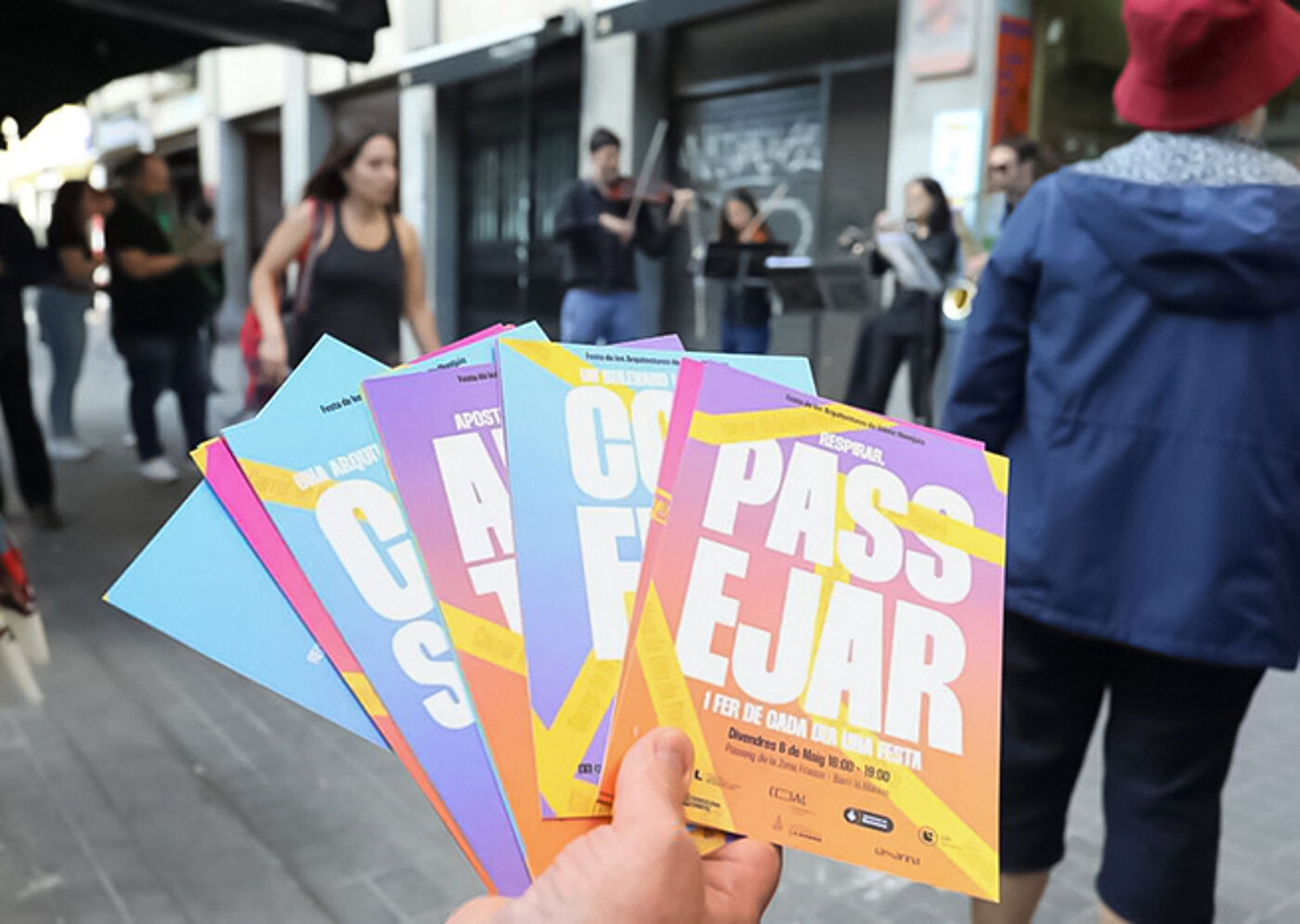 Colorful Event Flyers in Hand
