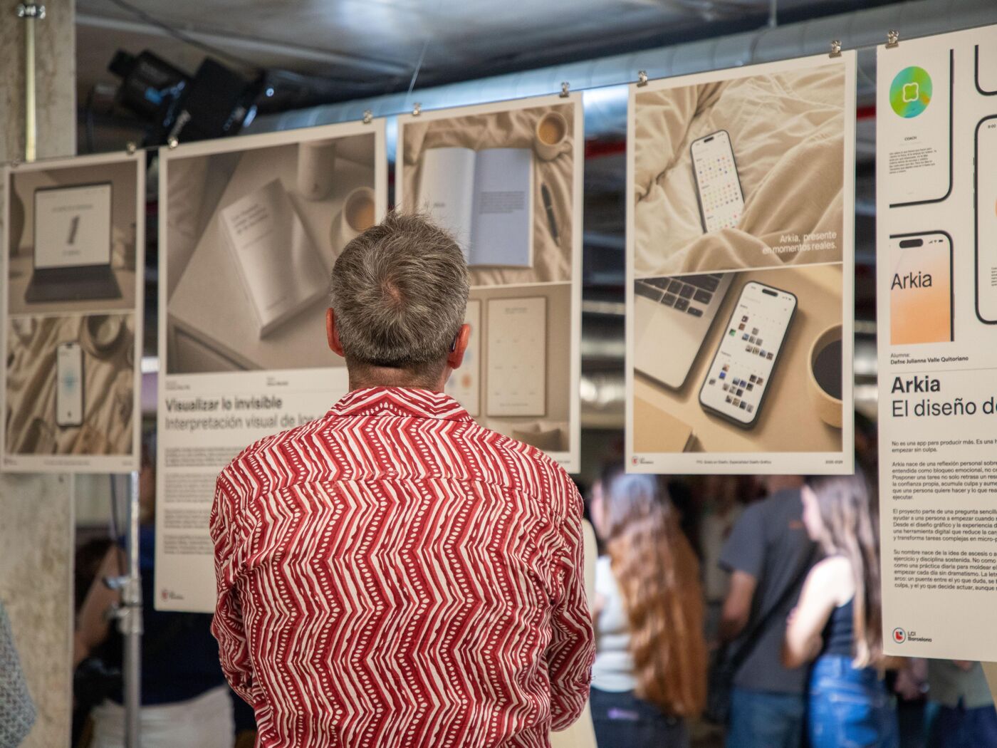 A visitor viewed exhibition posters and design boards during NEW'26, The Festival of New Ideas.