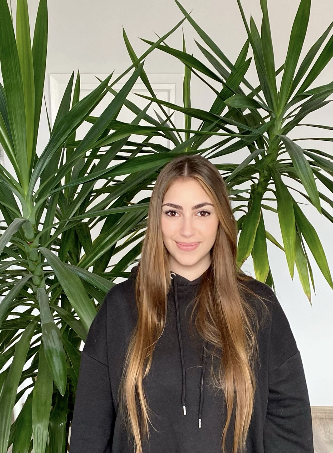 Young Woman with a Potted Plant