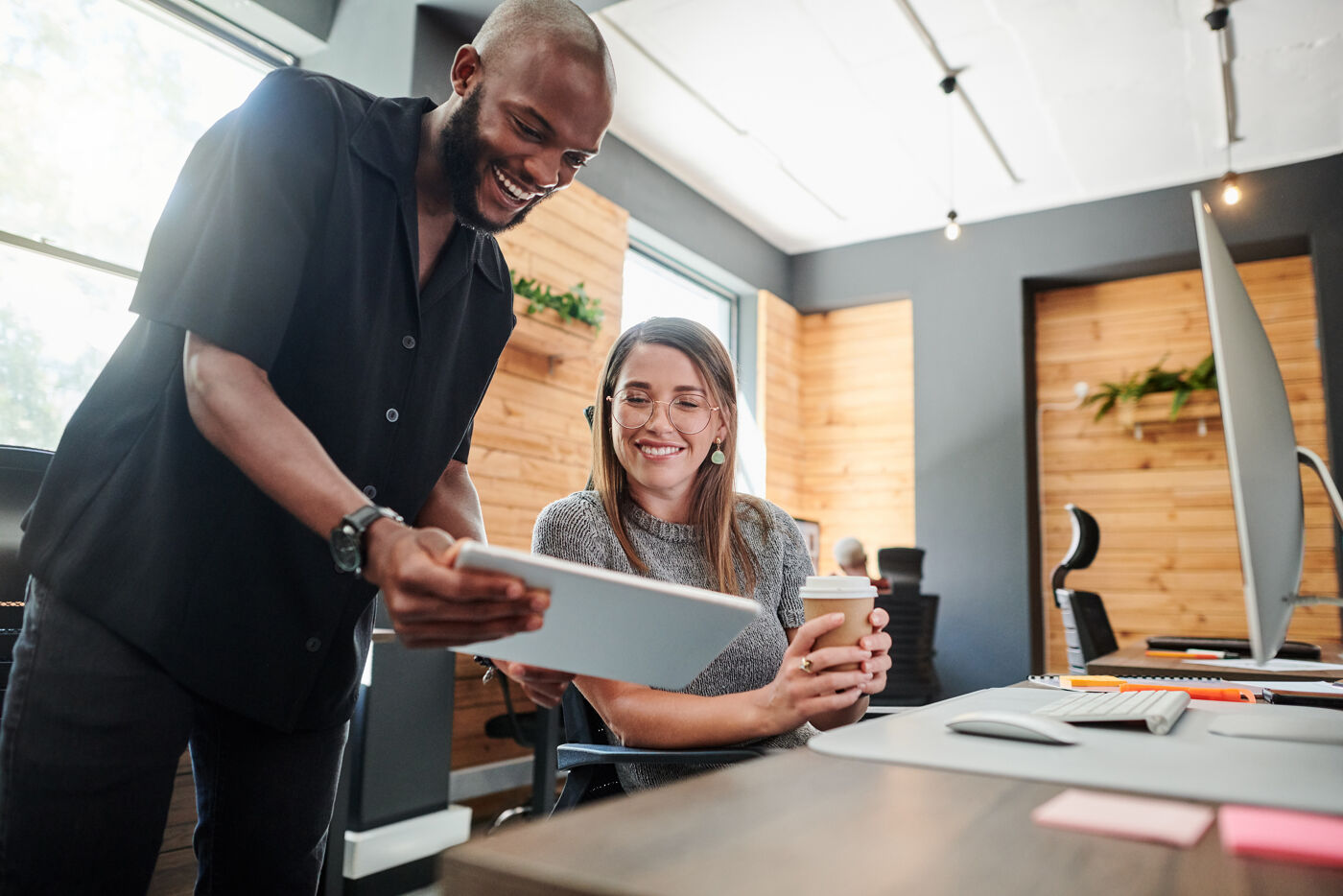 Shot of two businesspeople working together on a digital tablet in an office