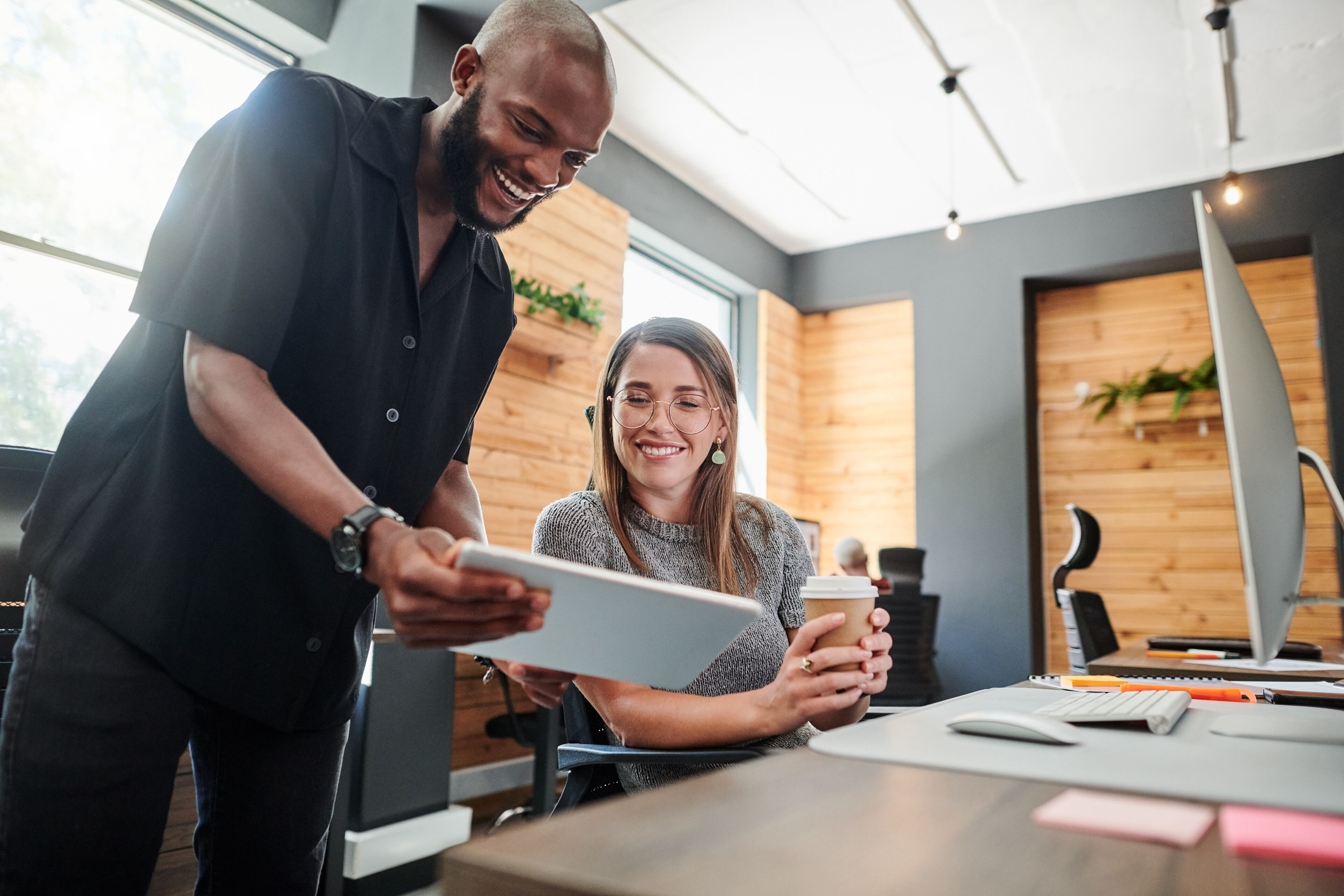 Shot of two businesspeople working together on a digital tablet in an office