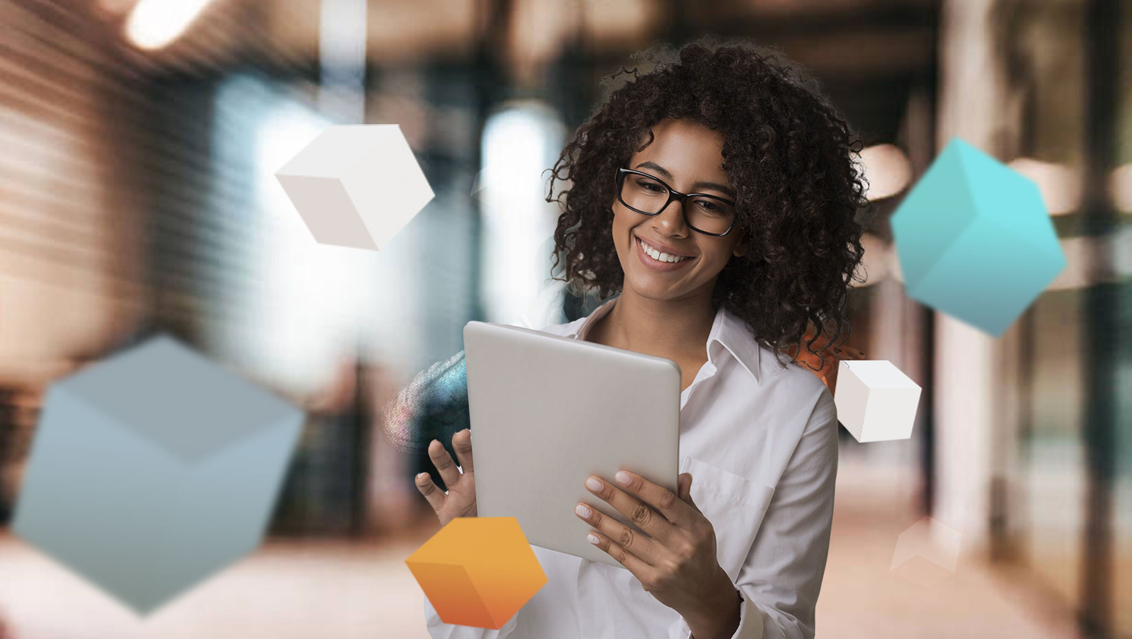 A cheerful woman interacts with floating 3D shapes on her tablet, symbolizing modern technology.