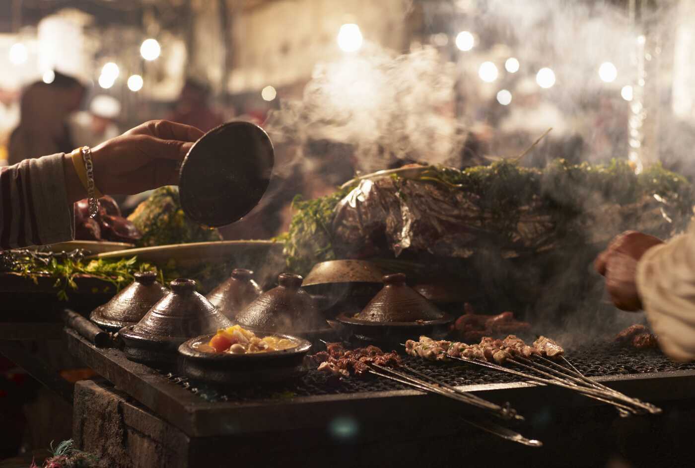 Traditional food cooked in open market stall