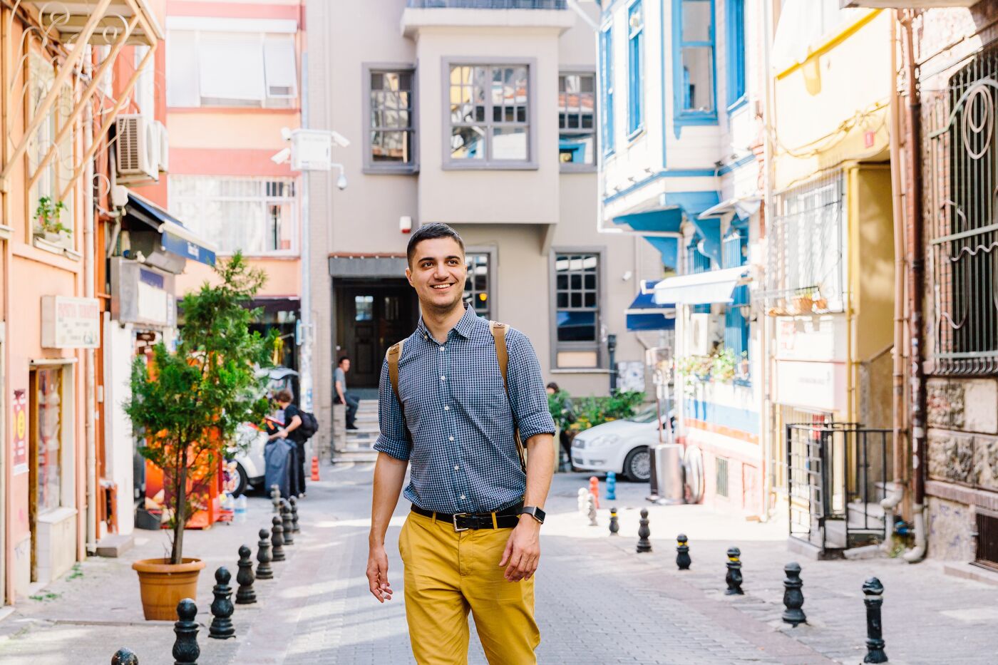 Young smiling happy man walking on the street in Istanbul, Turkey