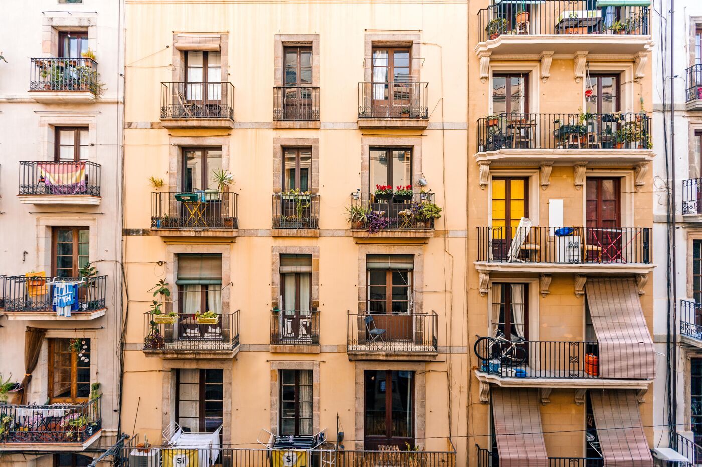 Balconies and windows on the facade of a residential building in El Born district in Barcelona, Spain