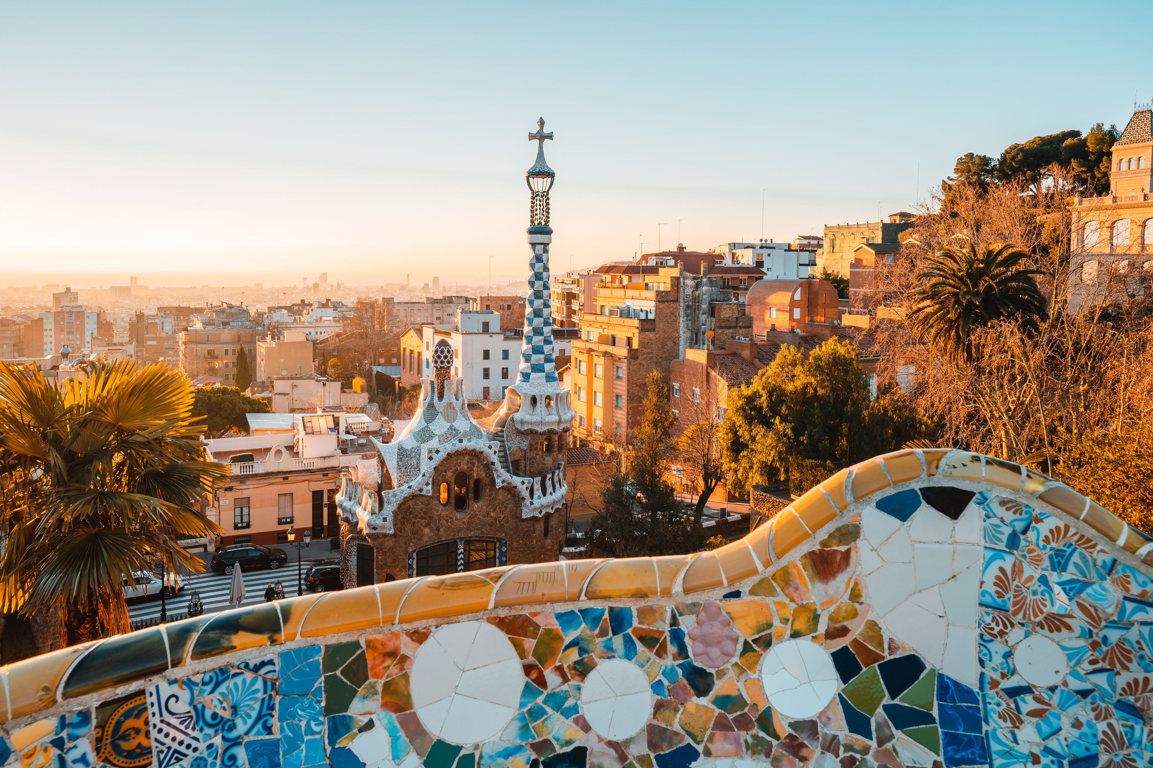 View of the city from Parc Guell in Barcelona, Spain, with the colors of sunrise.
