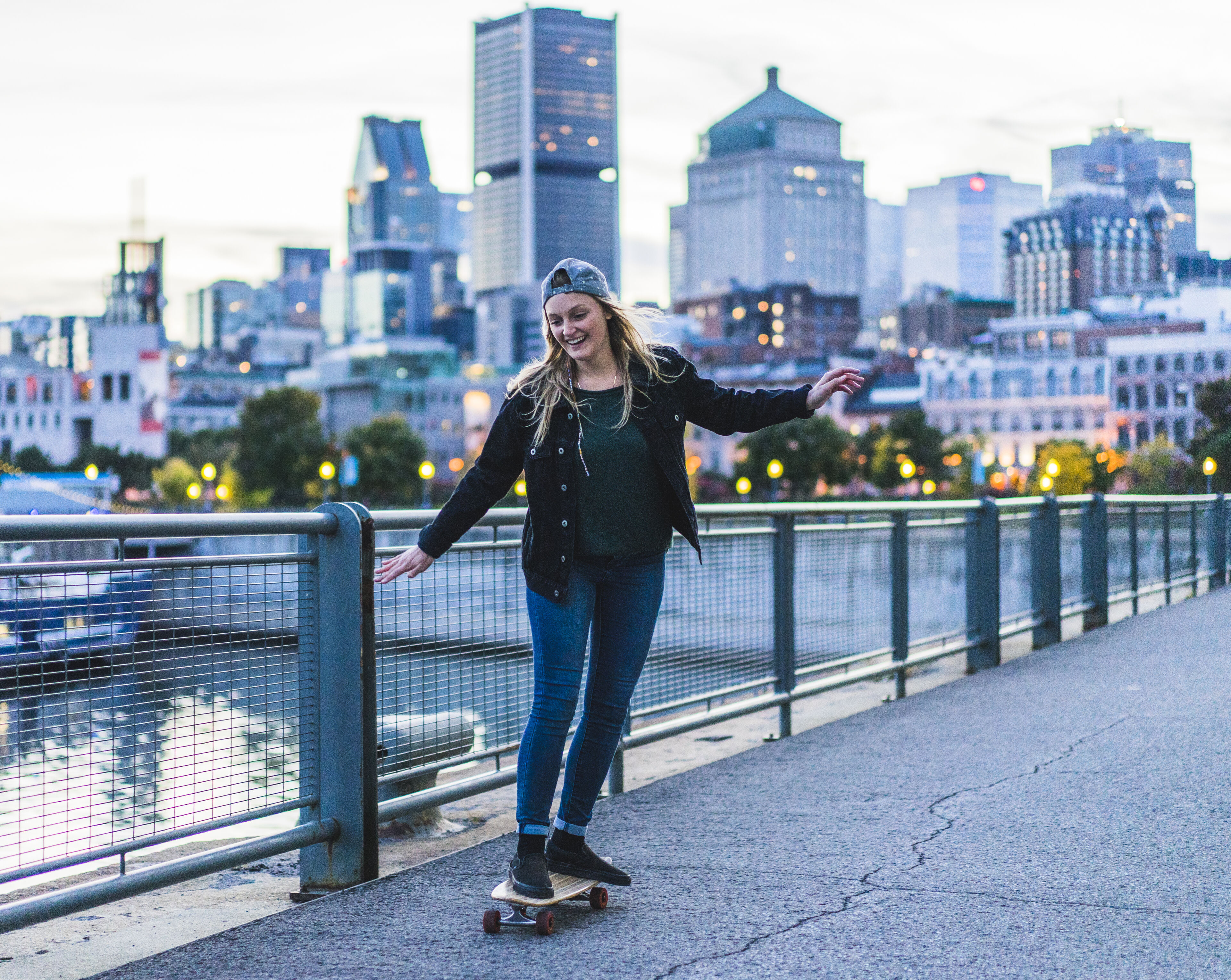 Portrait of young teenage girl with cityscape behind, Montreal, Quebec, Canada
