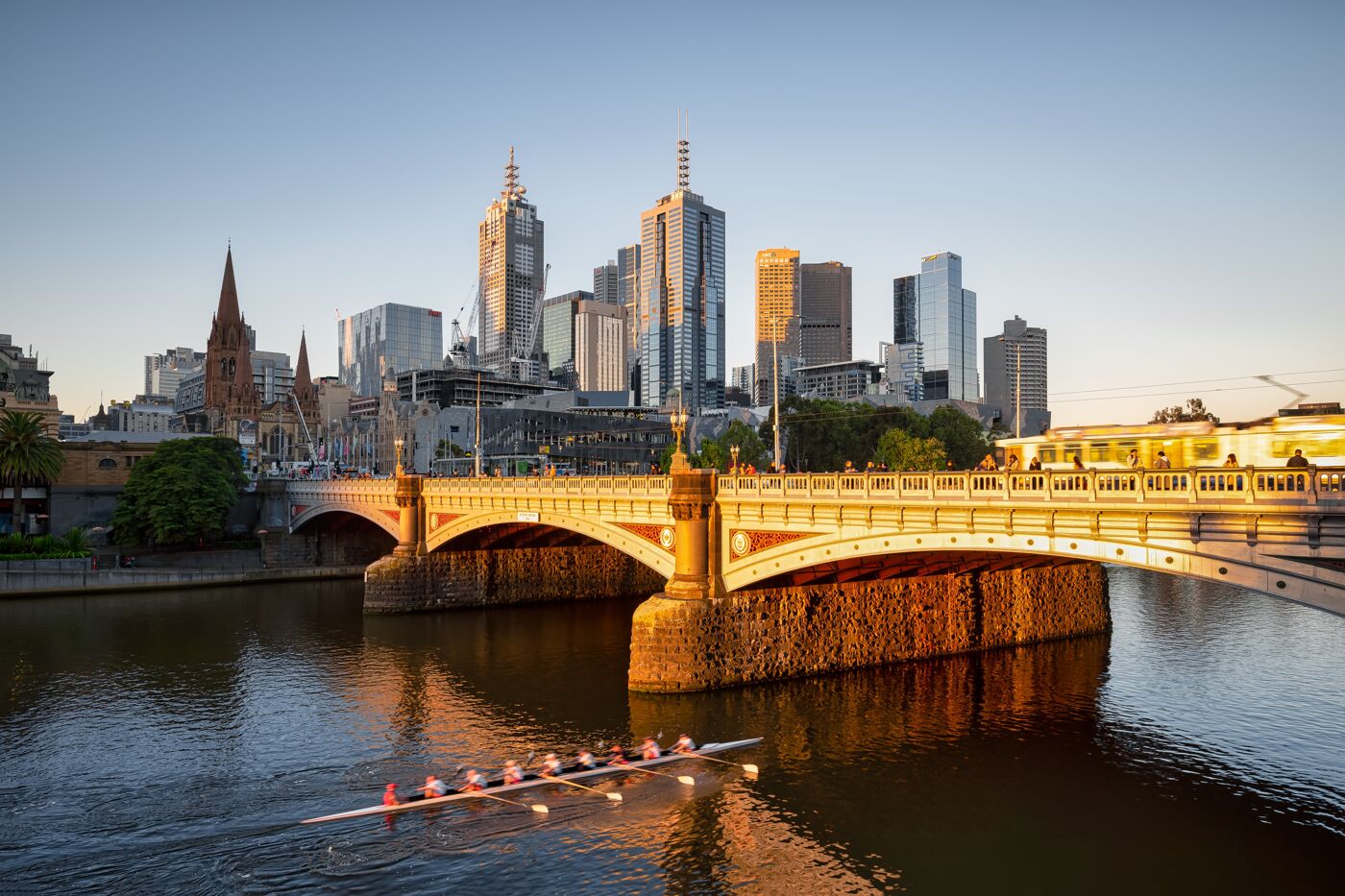 unset shot of the famous Yarra River in Melbourne, Australia, showing the city center in the middle.