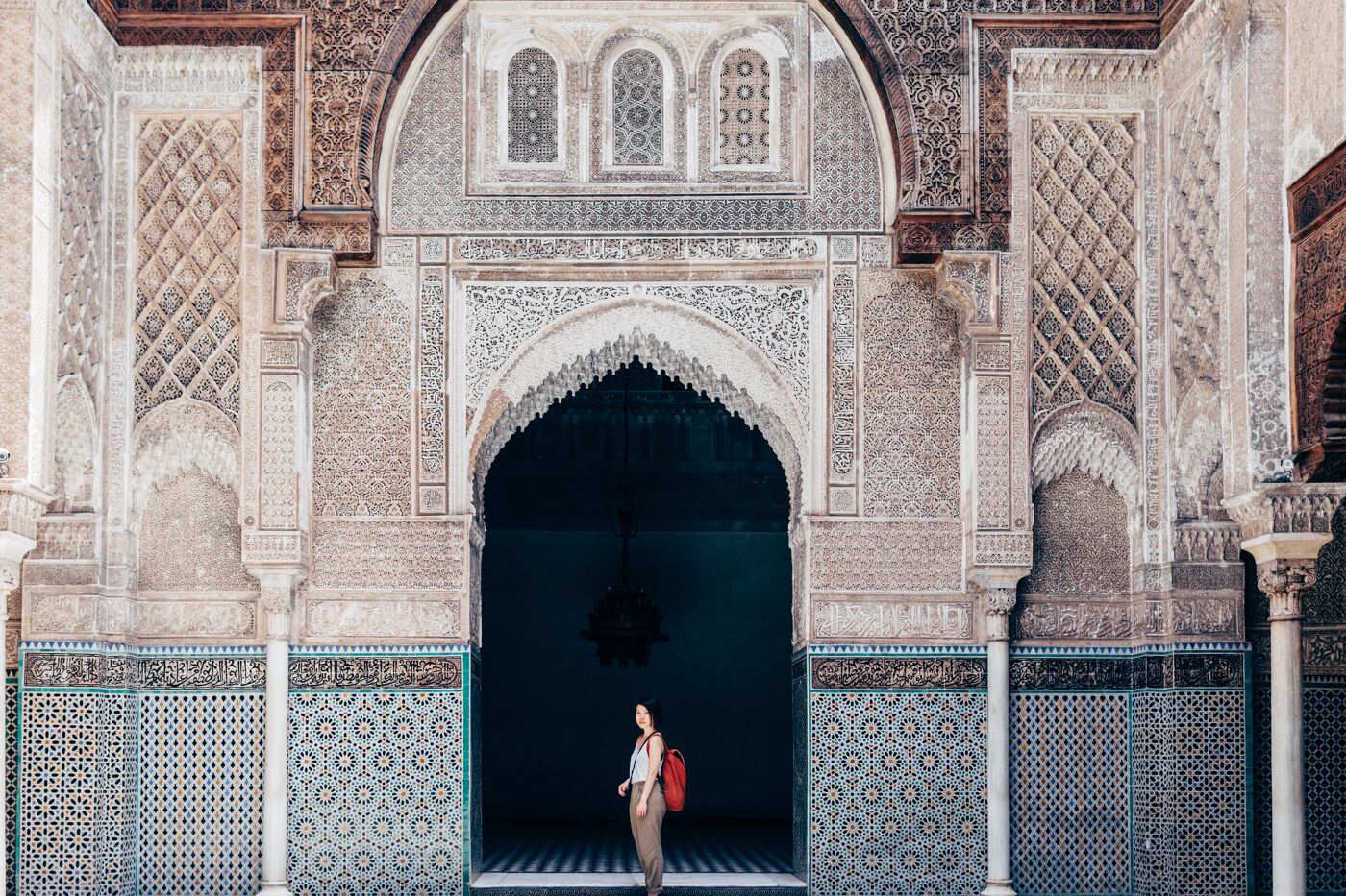 Woman tourist visiting old temple in Marrakech