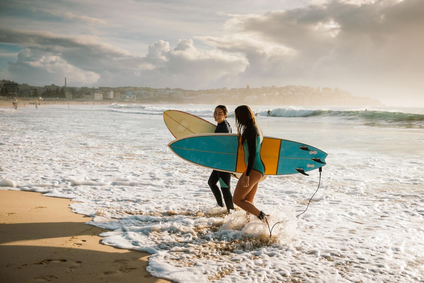 Surfing is a way of living in Australia and young and mature sporty women go surfing every morning.