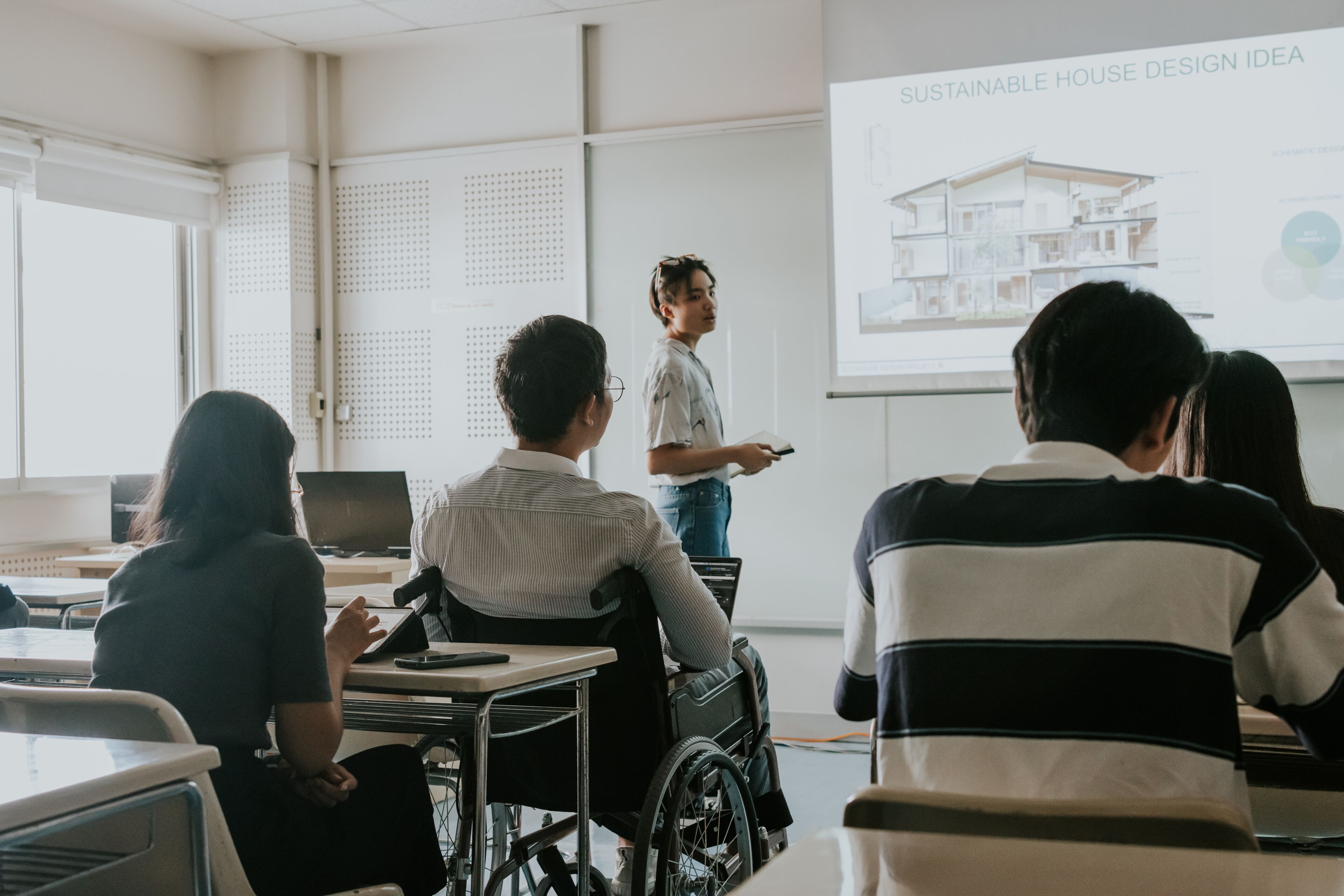 Asian disability architect student sitting on his wheelchair, equality to everyone to access the best education now, school of architecture and design lecture class