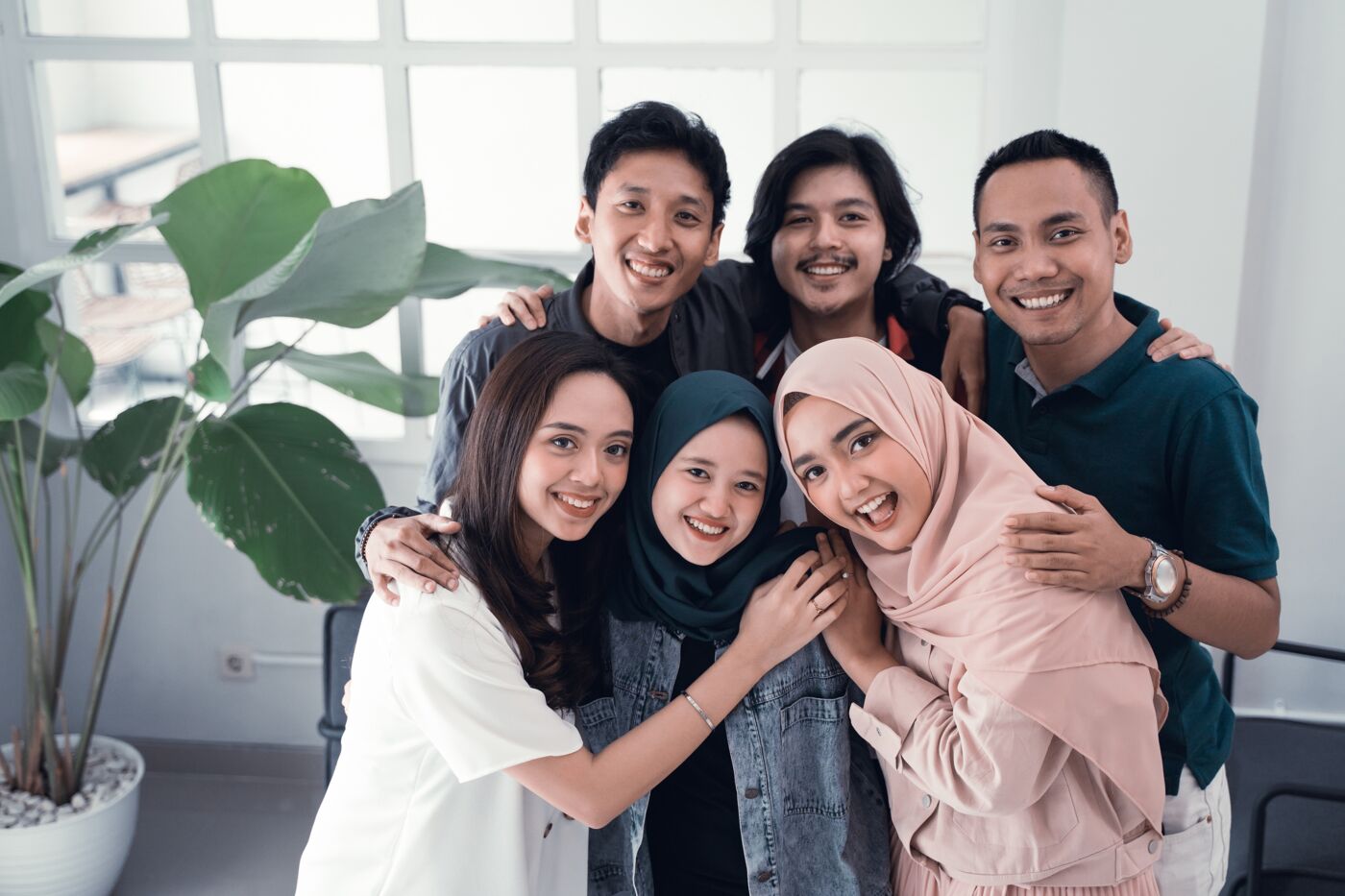 happy young asian friend together embrace smiling to camera