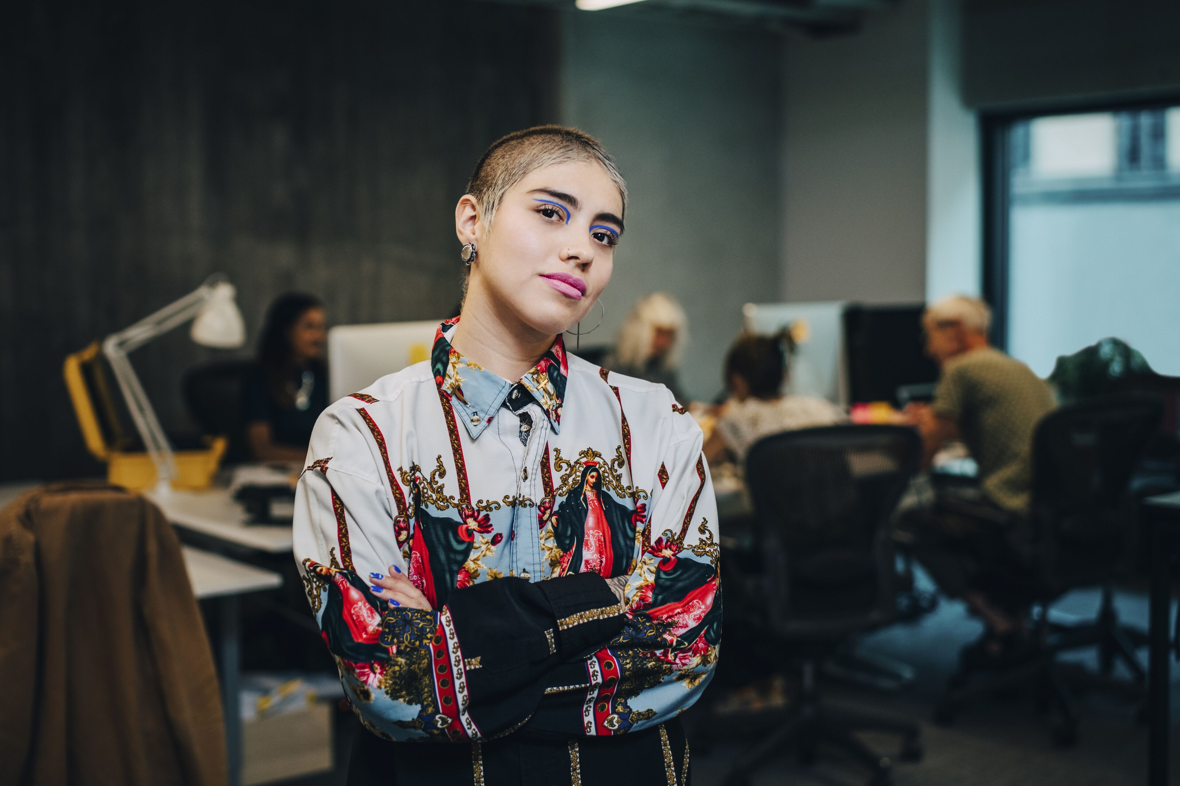 Portrait of businesswoman with arms crossed in IT company