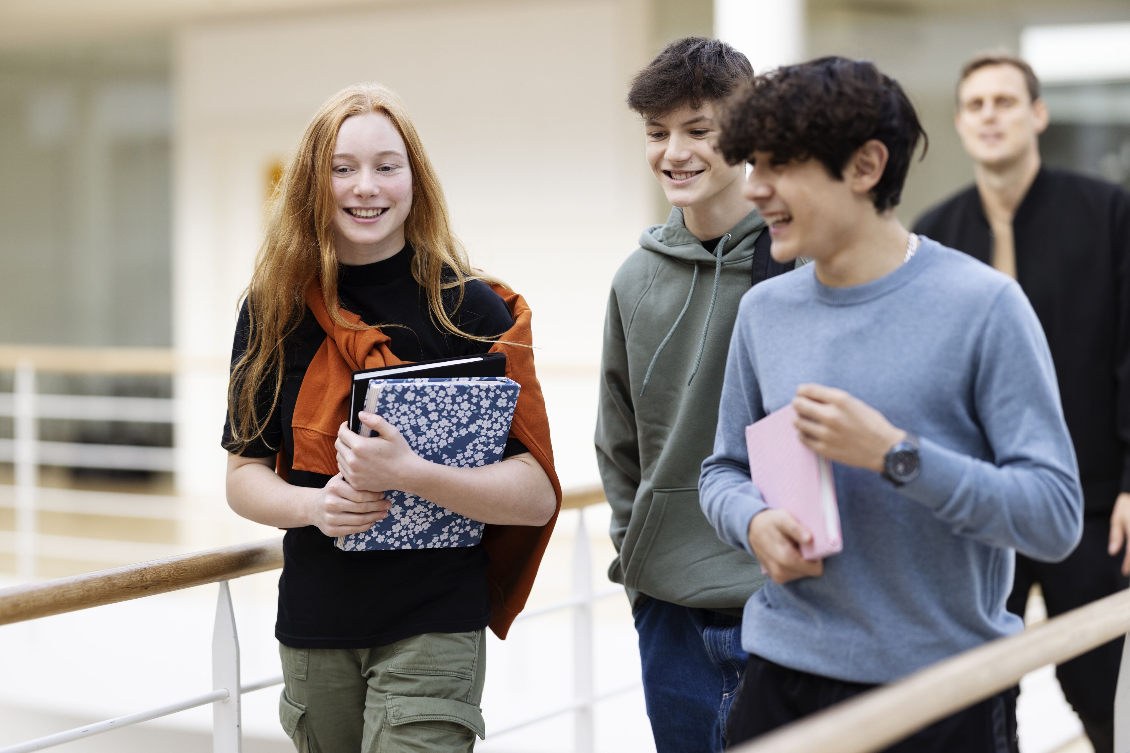 Teenage school students walking in hallway