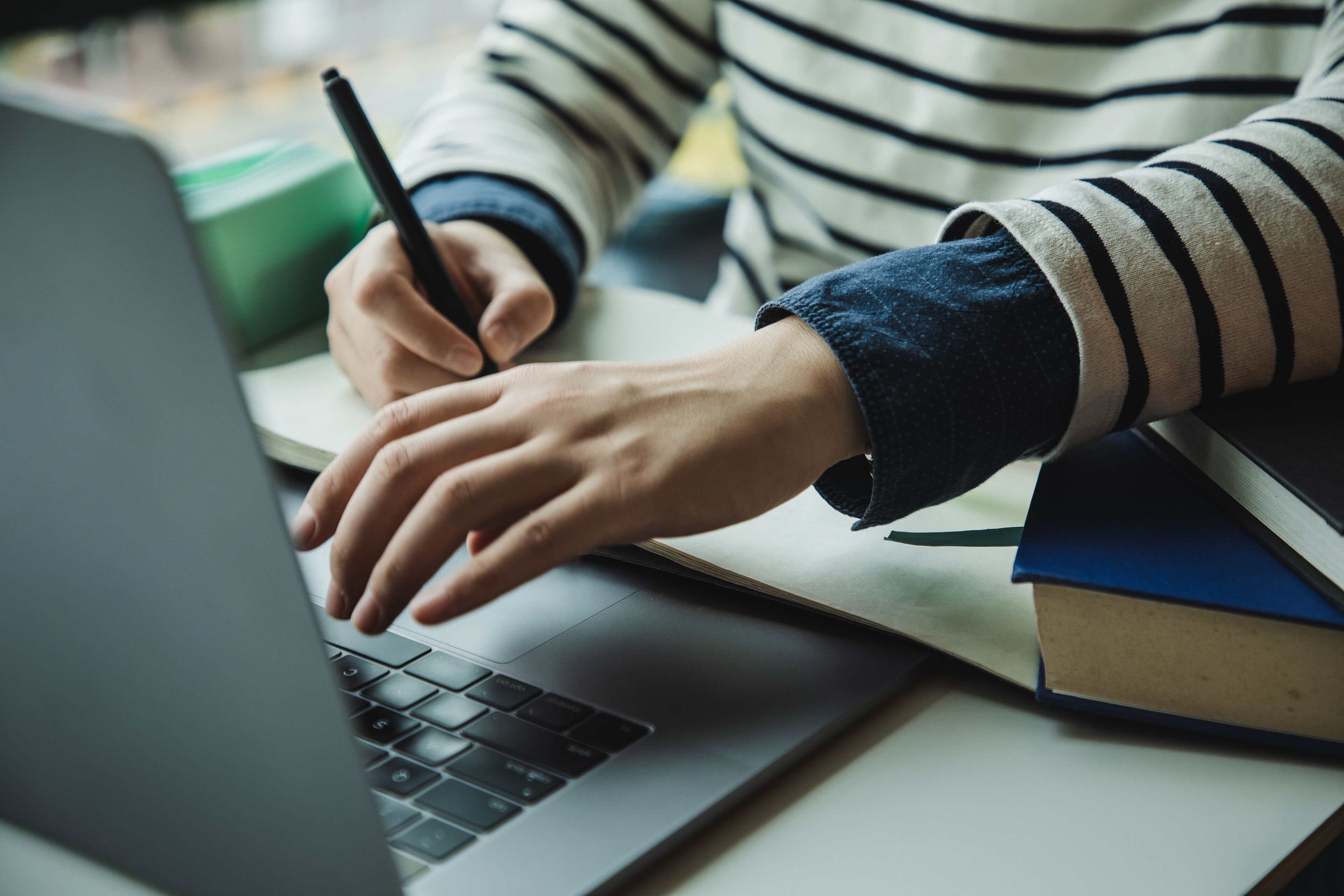 Asian woman in front of her laptop 