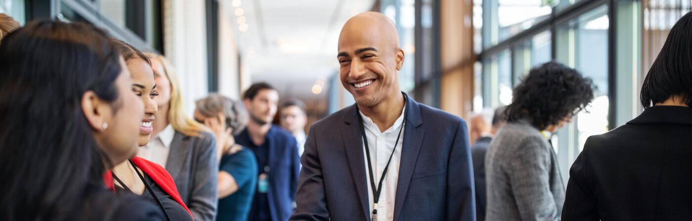 Professionals Shaking Hands at Networking Event