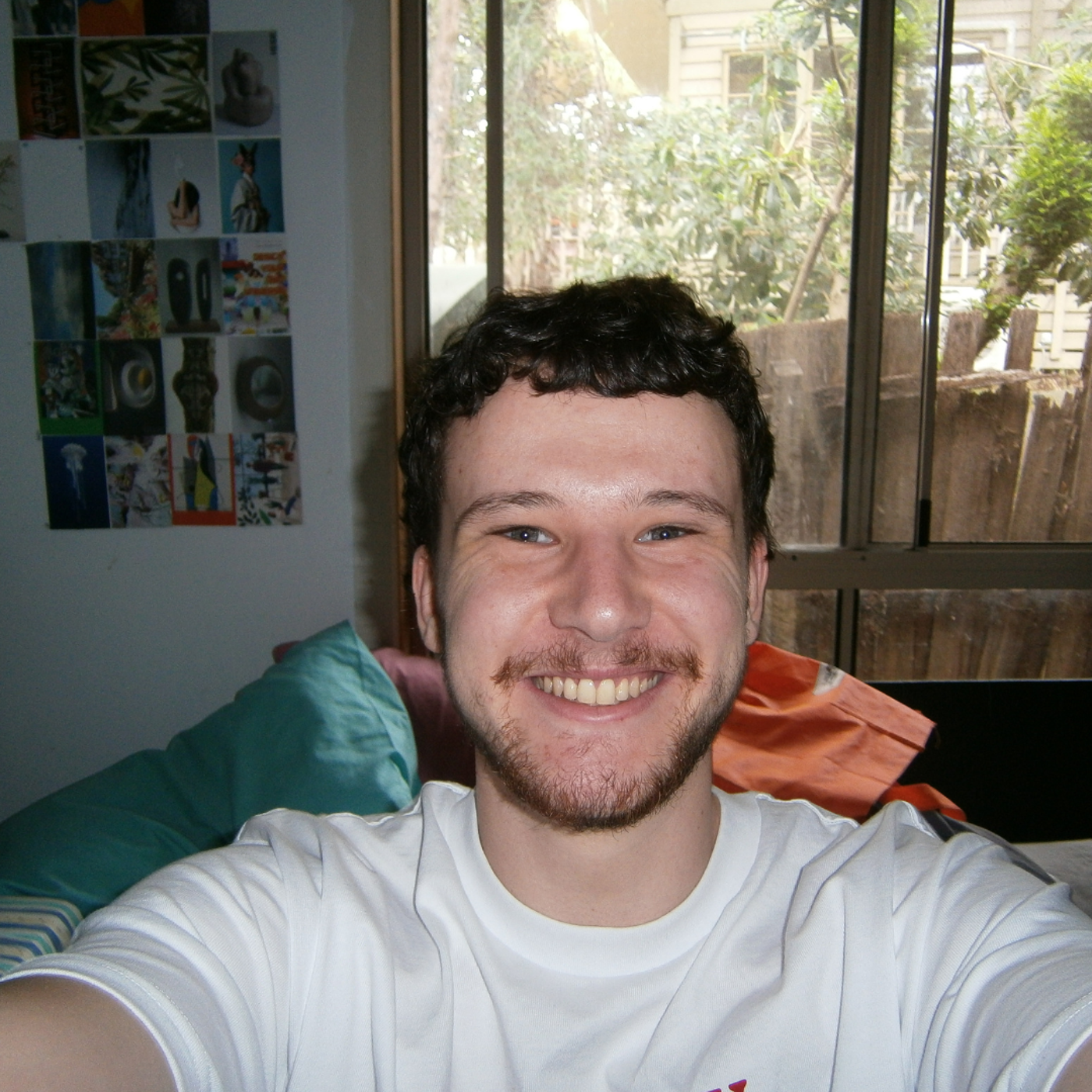 Smiling Young Man Taking a Selfie