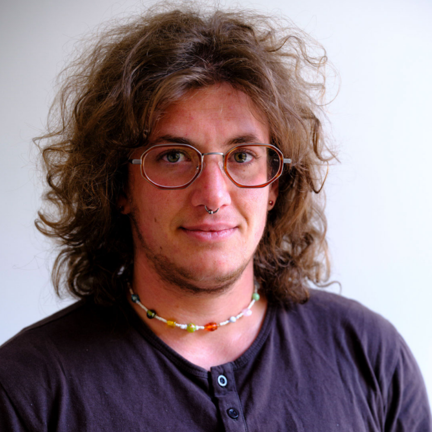 Portrait of a Man with Curly Hair and Glasses