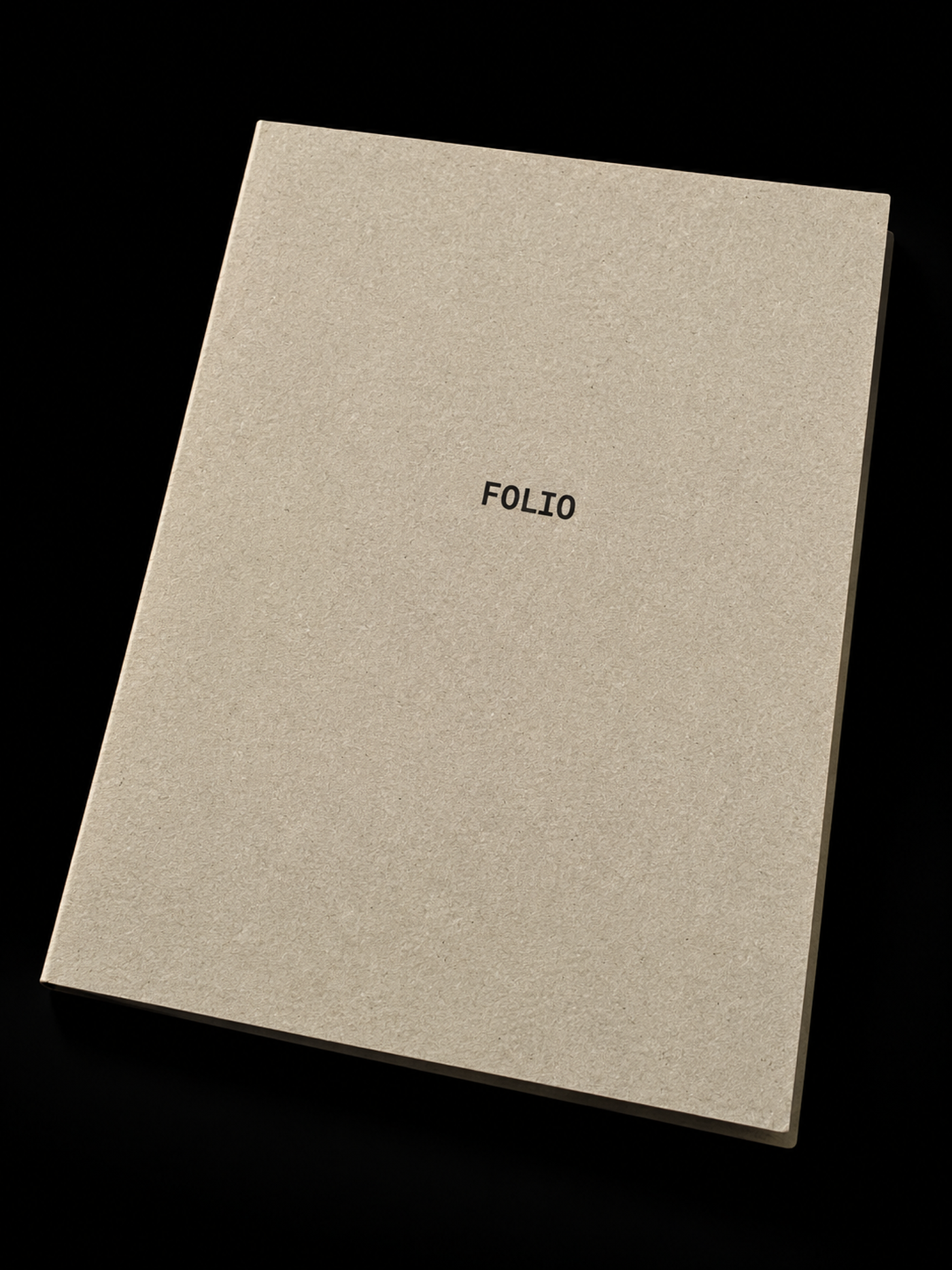 This is an image of a plain, light brown, hardcover book or portfolio with the word "FOLIO" printed in black, sans-serif text on the front cover.
