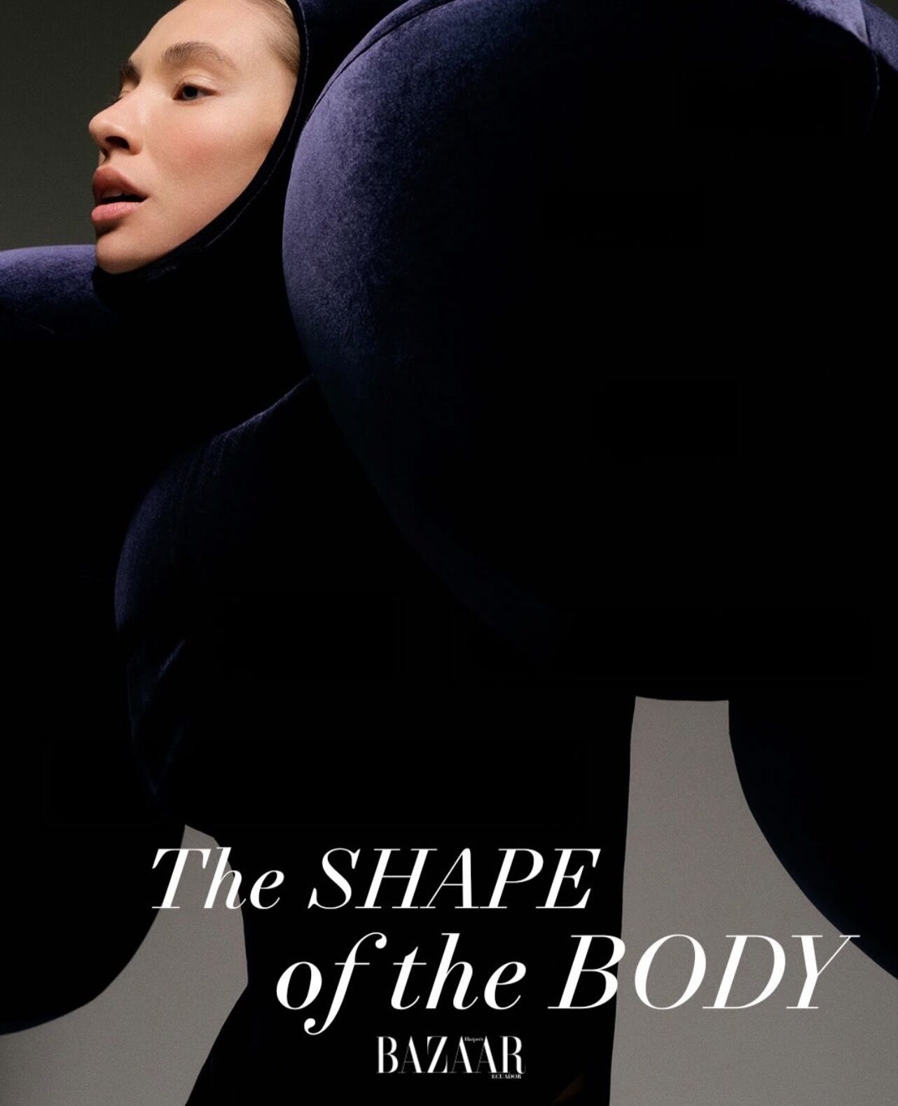 A woman in a voluminous, dark outfit poses for a Harper's Bazaar photoshoot, with the title "The Shape of the Body".
