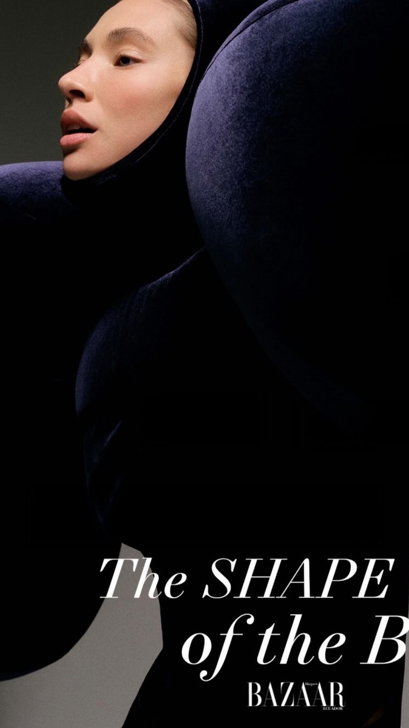 A woman in a voluminous, dark outfit poses for a Harper's Bazaar photoshoot, with the title "The Shape of the Body".
