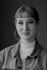 Smiling Woman in Denim Jacket